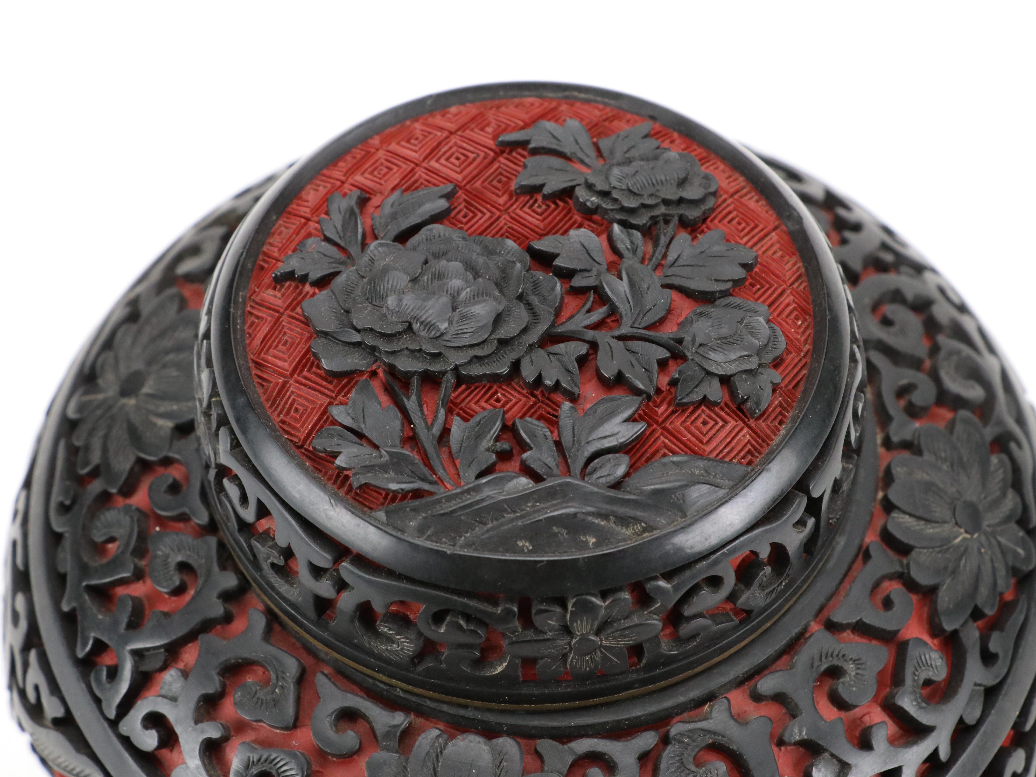 Chinese Black on Red Cinnabar Ginger Jar with Ebonized Wood Stand