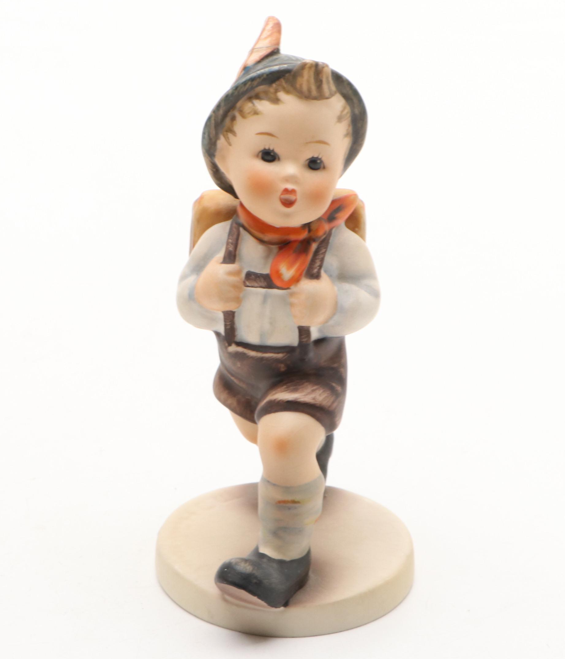 Goebel Cheryl Johnson Vase with "School Boy" and Other Hummel Figurines