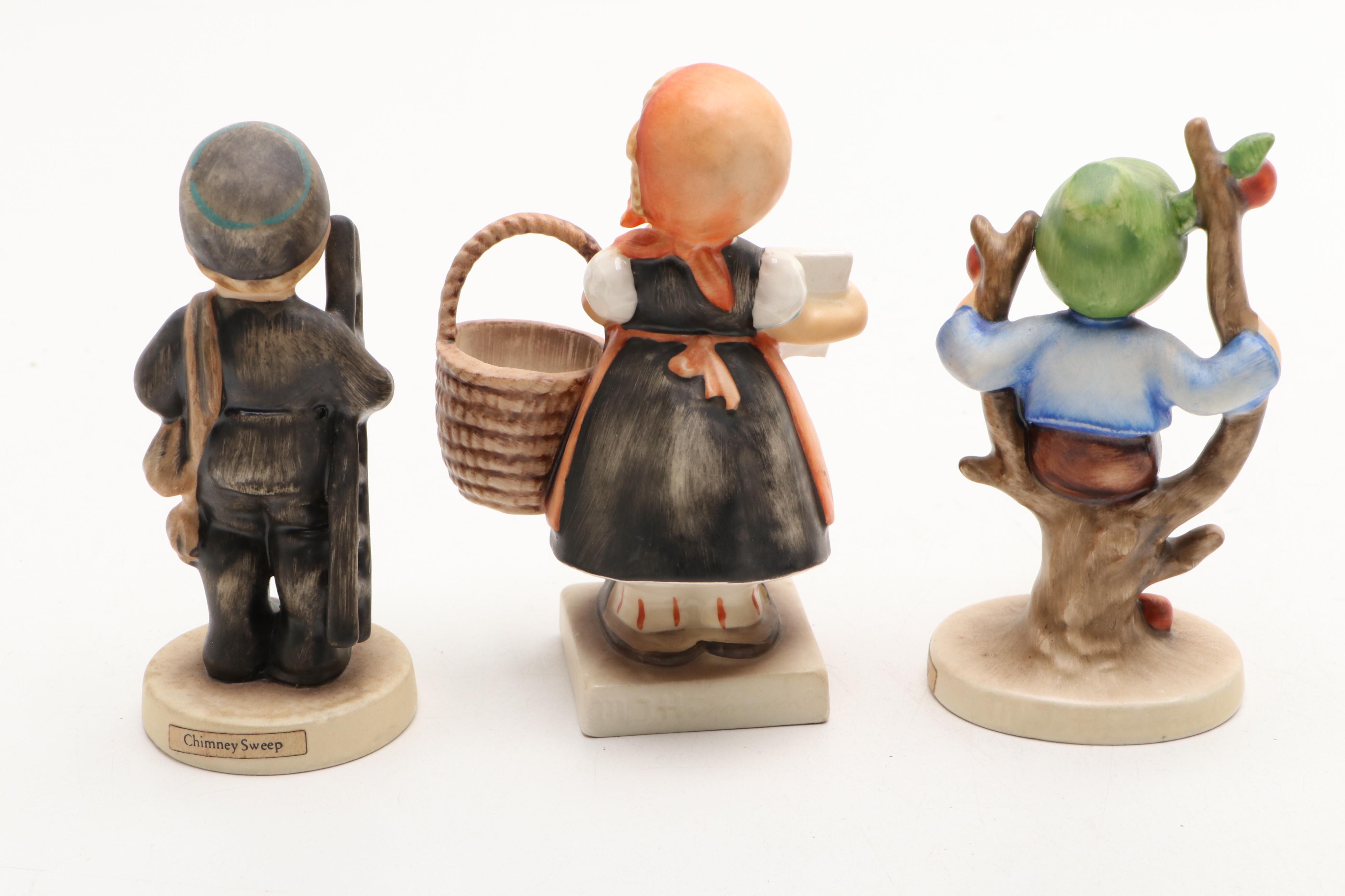 Goebel Cheryl Johnson Vase with "School Boy" and Other Hummel Figurines
