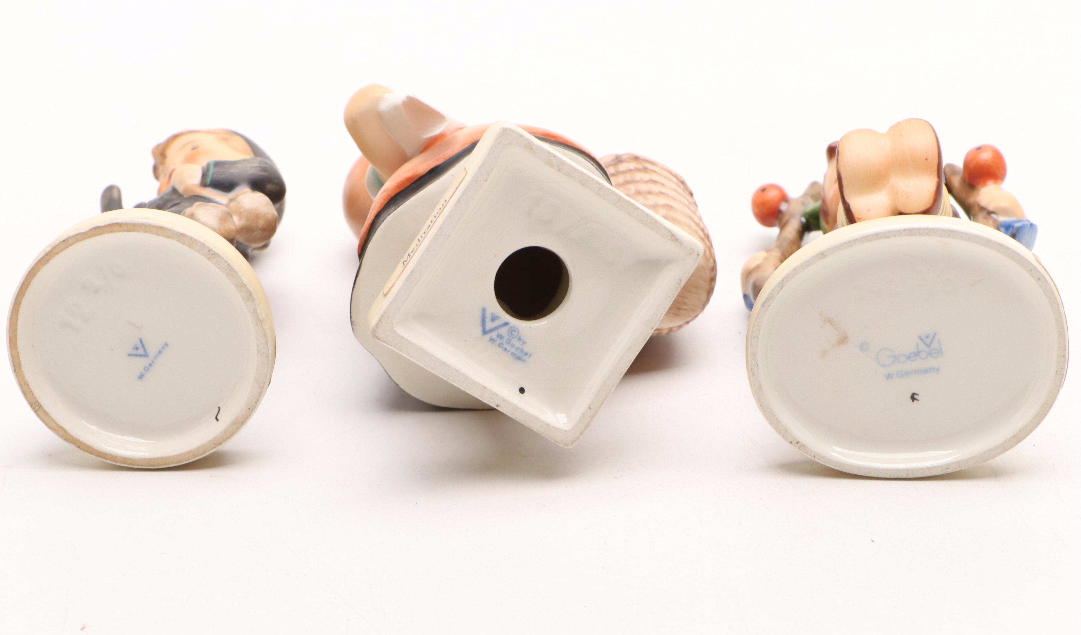 Goebel Cheryl Johnson Vase with "School Boy" and Other Hummel Figurines