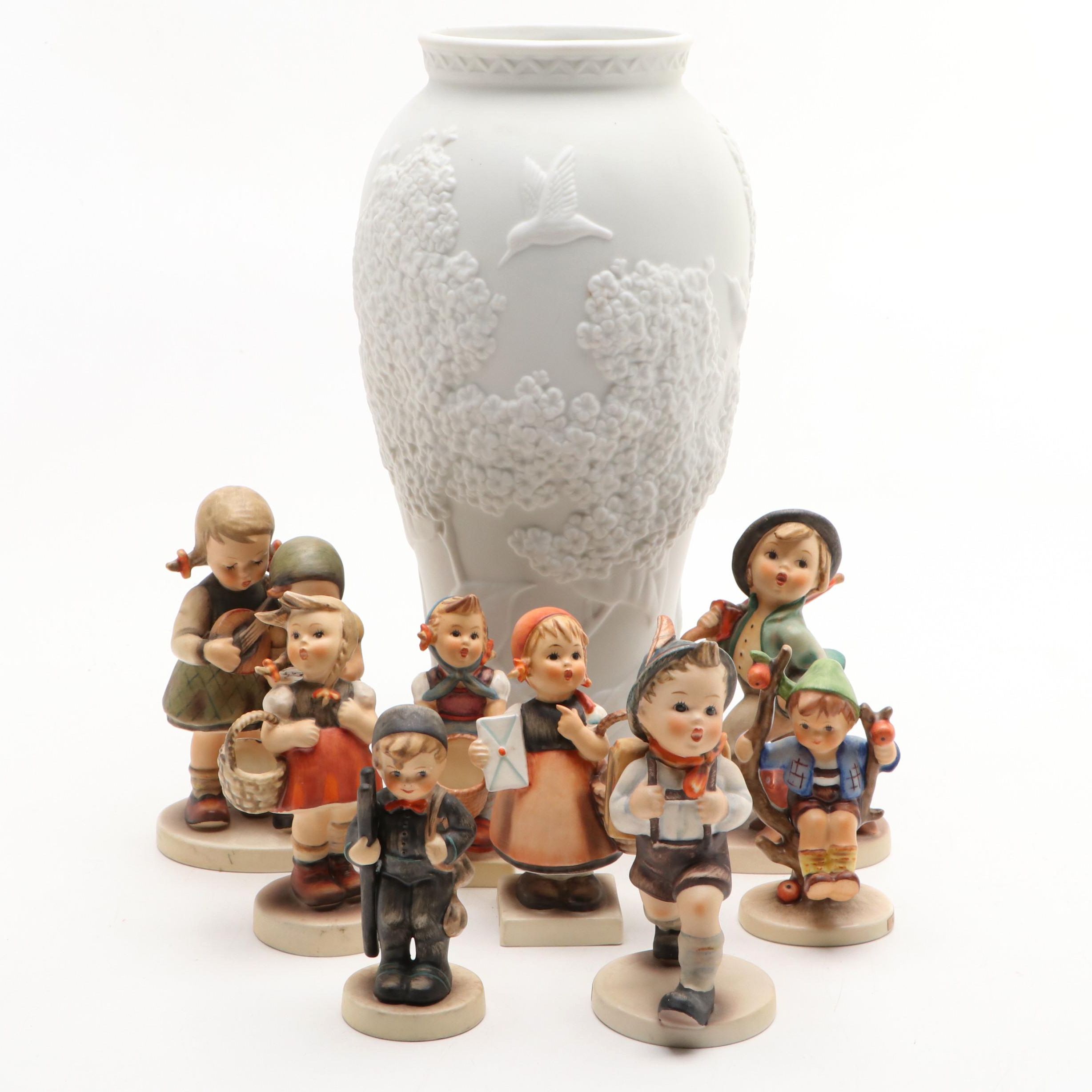 Goebel Cheryl Johnson Vase with "School Boy" and Other Hummel Figurines