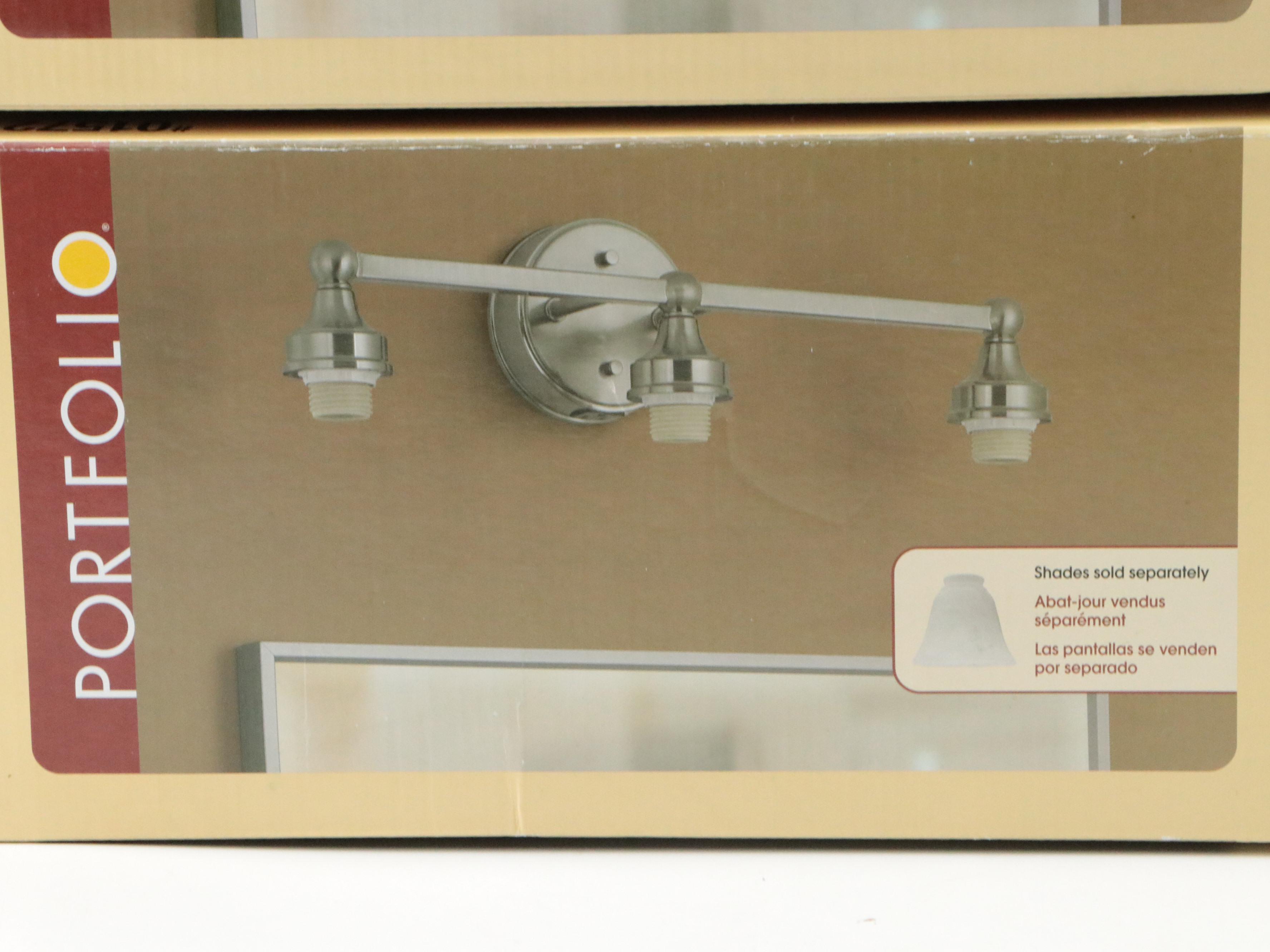 Pair of Portfolio Brushed Nickel Three-Arm Vanity Lights