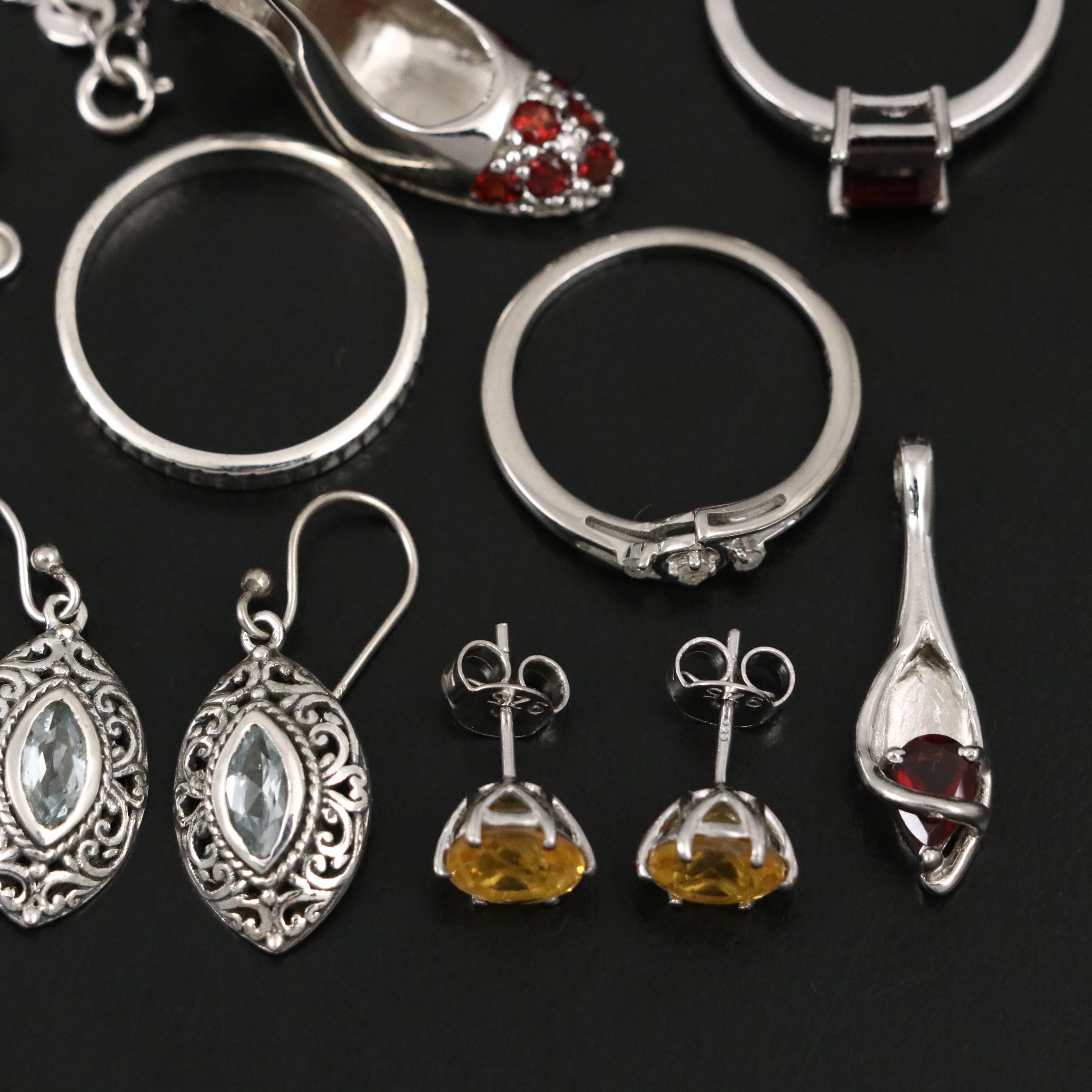 Group of 14 Assorted Sterling Silver Rings, Necklaces, Earrings, and Pendants