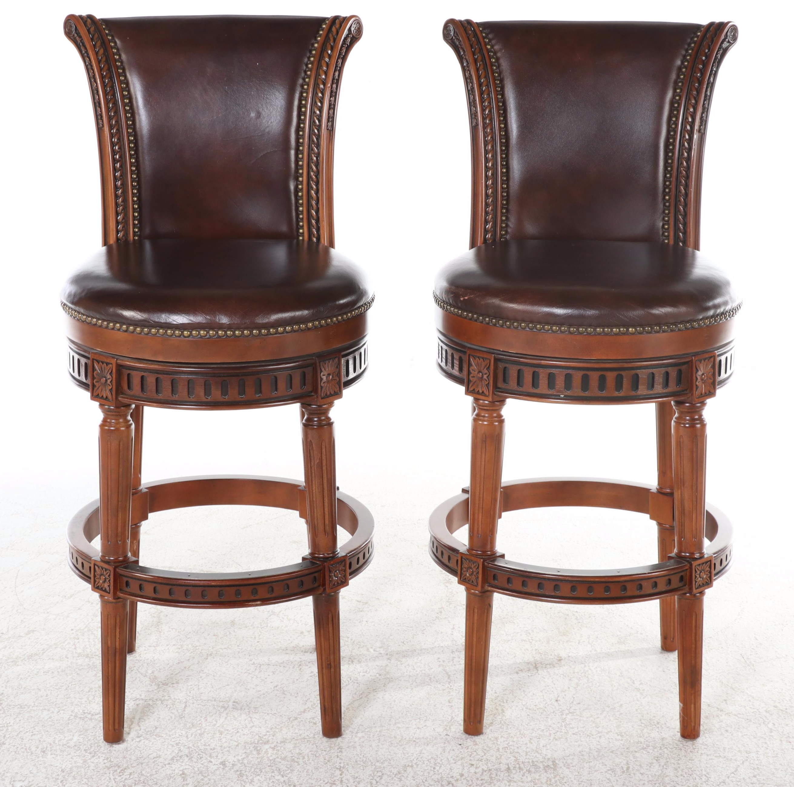 Four Frontgate "Manchester" Birch and Leather Swivel Bar Stools with Nailheads