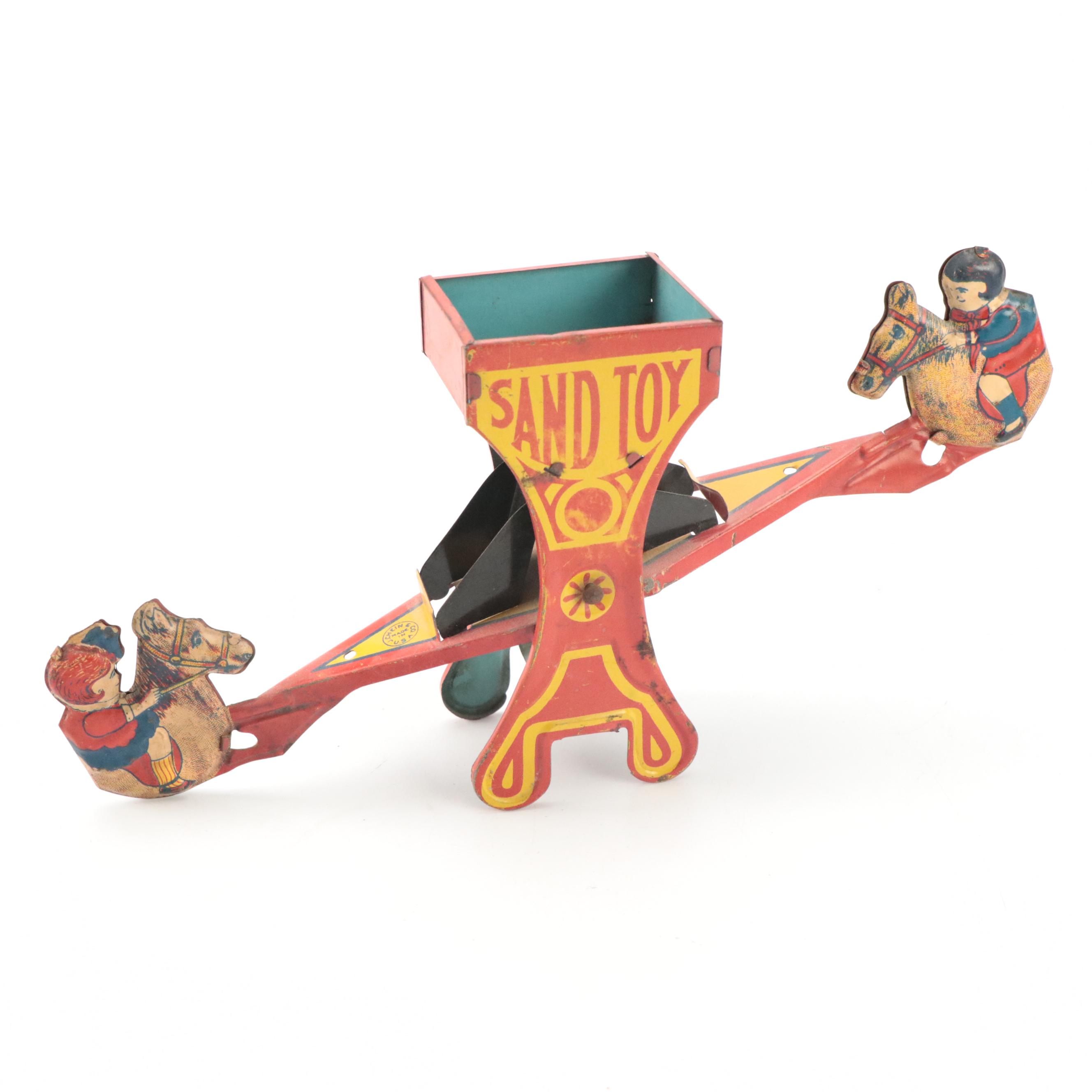 J. Chein & Co. Tin Lithograph Teeter-Totter Sand Toy, Mid-20th Century