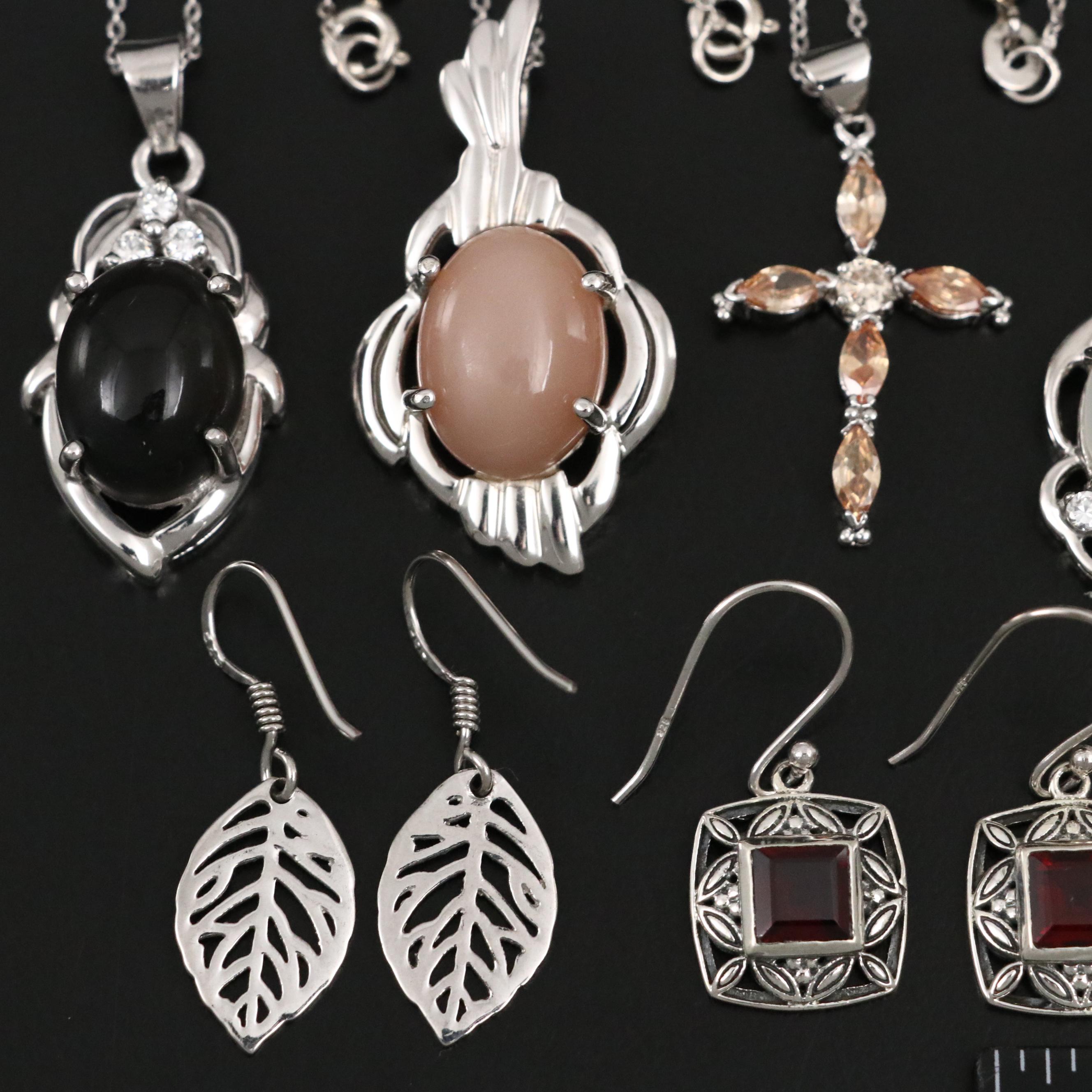 Group of 14 Assorted Sterling Silver Rings, Necklaces, Earrings, and Pendants