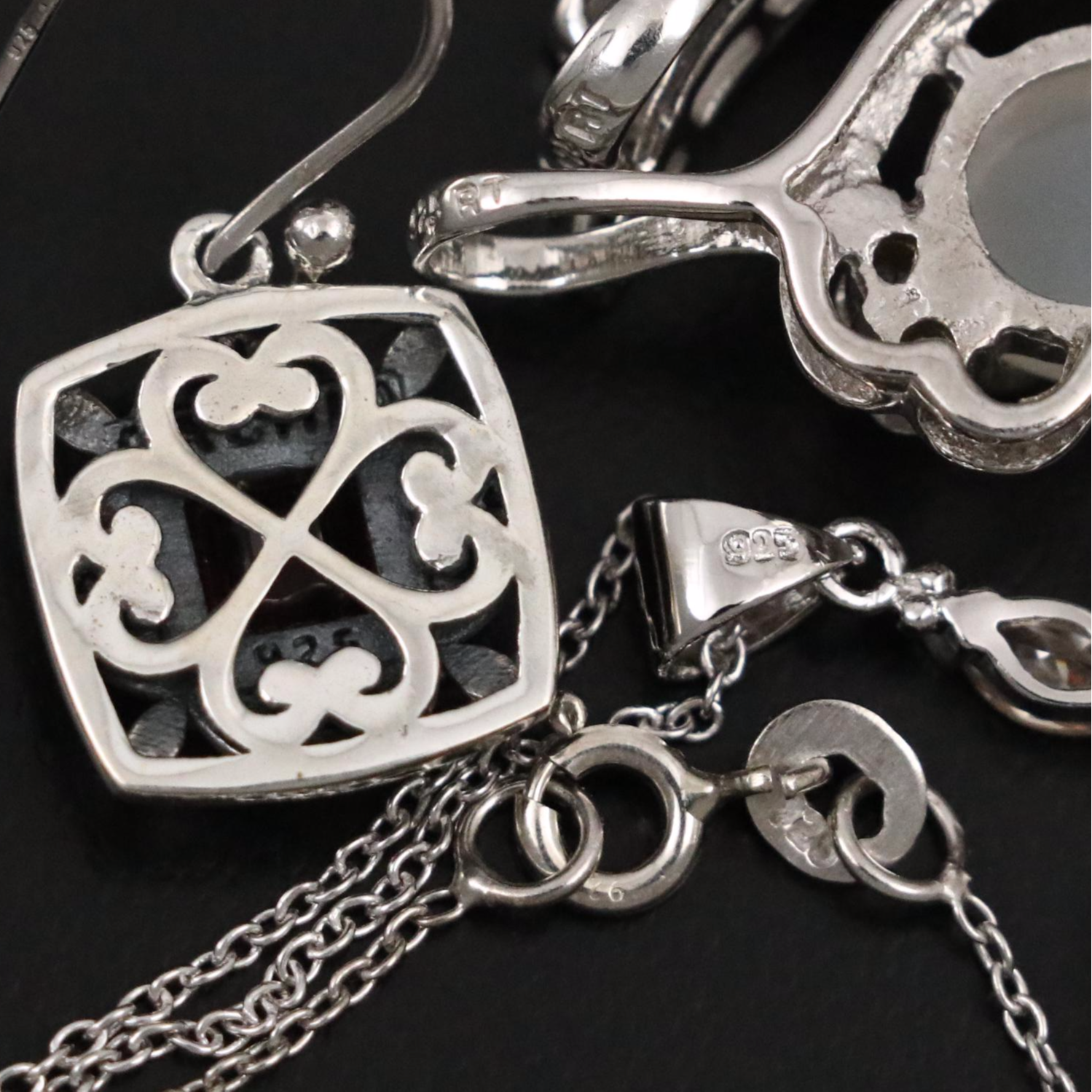 Group of 14 Assorted Sterling Silver Rings, Necklaces, Earrings, and Pendants