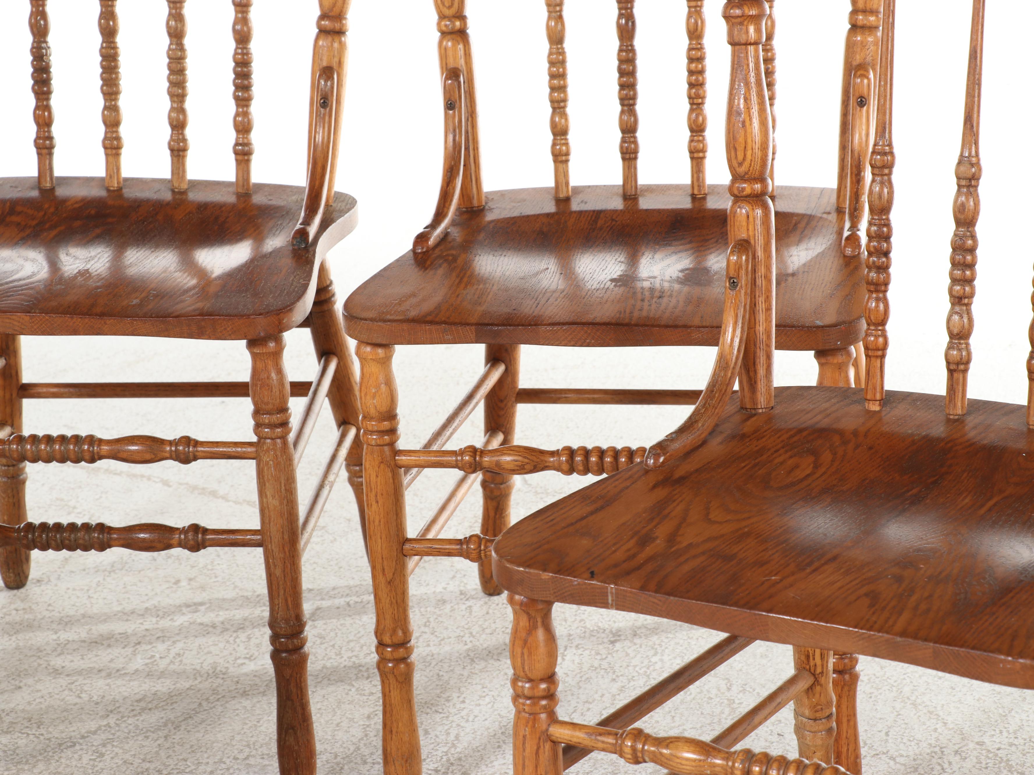 Four H.W. Hull & Sons Victorian Style Oak and Pressed-Back Dining Side Chairs