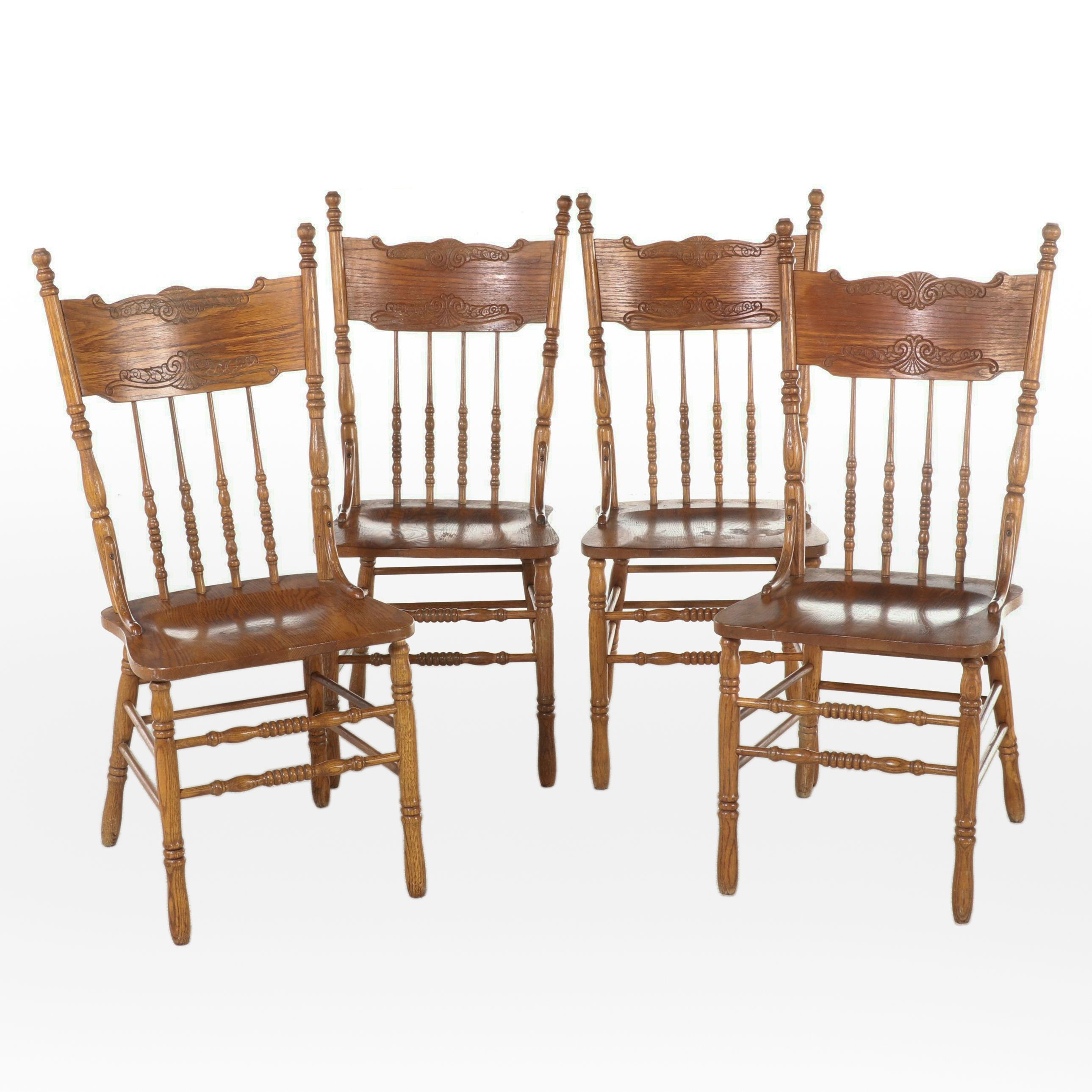 Four H.W. Hull & Sons Victorian Style Oak and Pressed-Back Dining Side Chairs