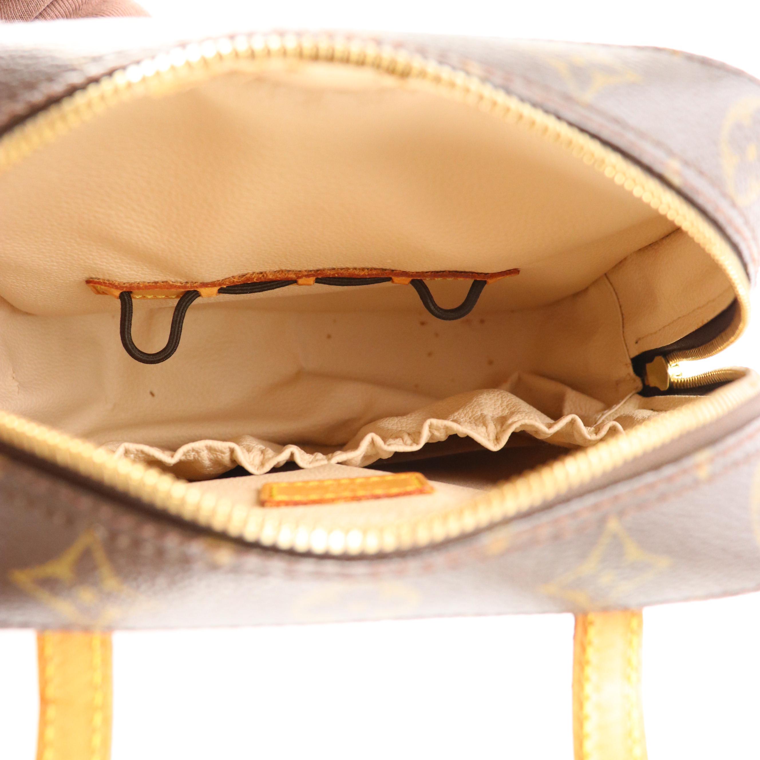 Louis Vuitton Spontini Handbag in Monogram Canvas and Vachetta Leather