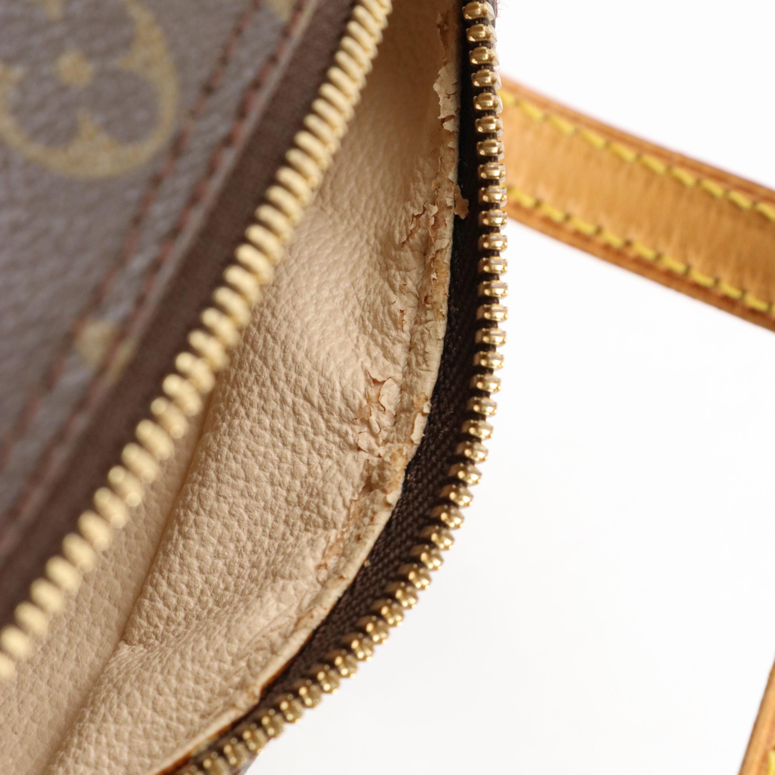 Louis Vuitton Spontini Handbag in Monogram Canvas and Vachetta Leather