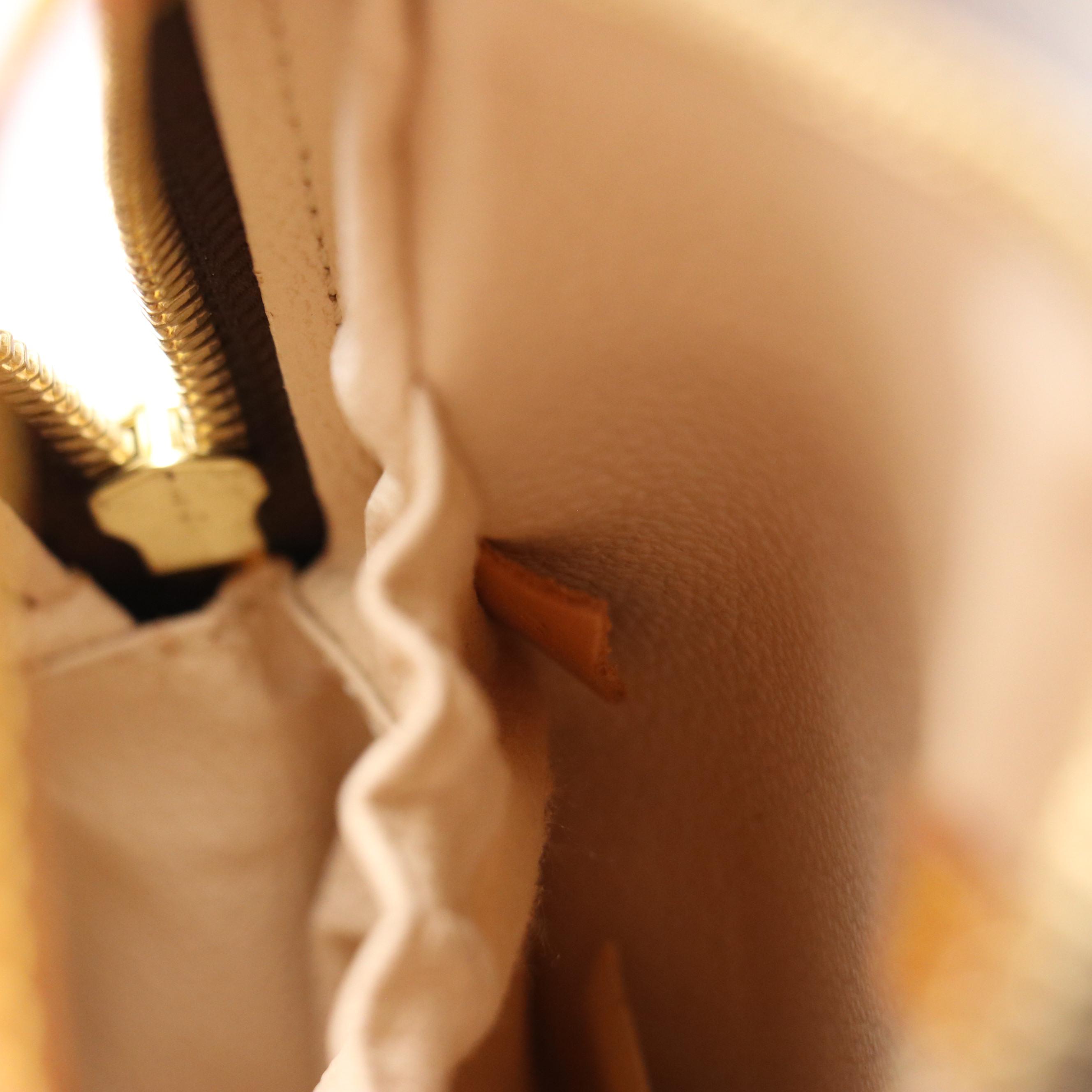 Louis Vuitton Spontini Handbag in Monogram Canvas and Vachetta Leather