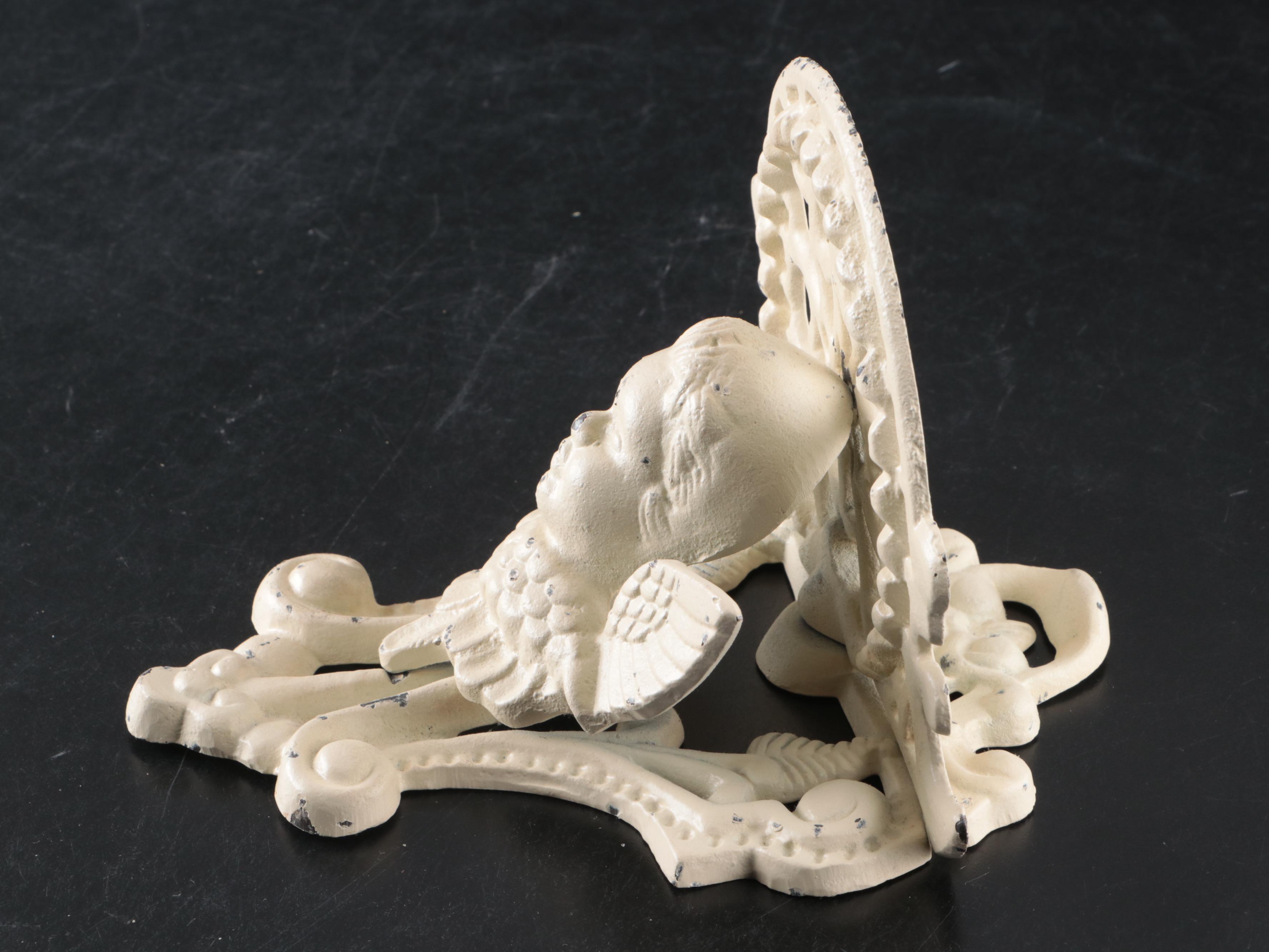 Baroque Style Cast Iron Wall Sculpture with Cherub Motif Cast Iron Wall Shelf