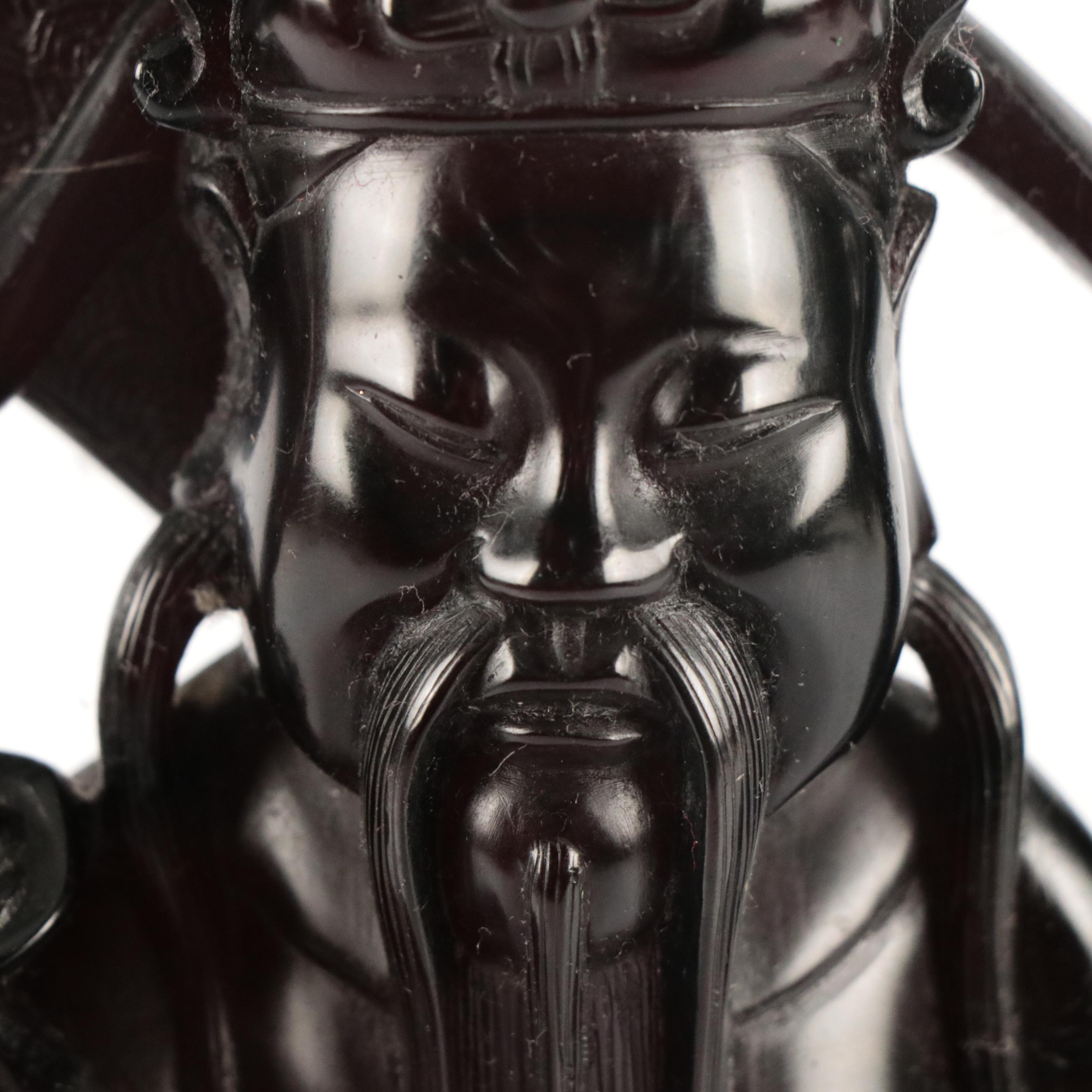 Chinese Carved Cherry Amber Resin Sculpture of Deity