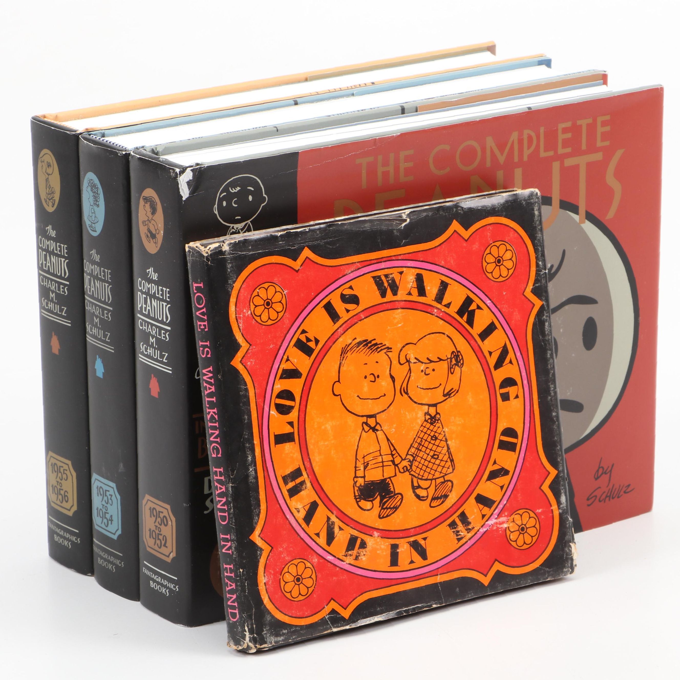 "The Complete Peanuts" and "Love is Walking Hand in Hand" by Charles M. Schulz