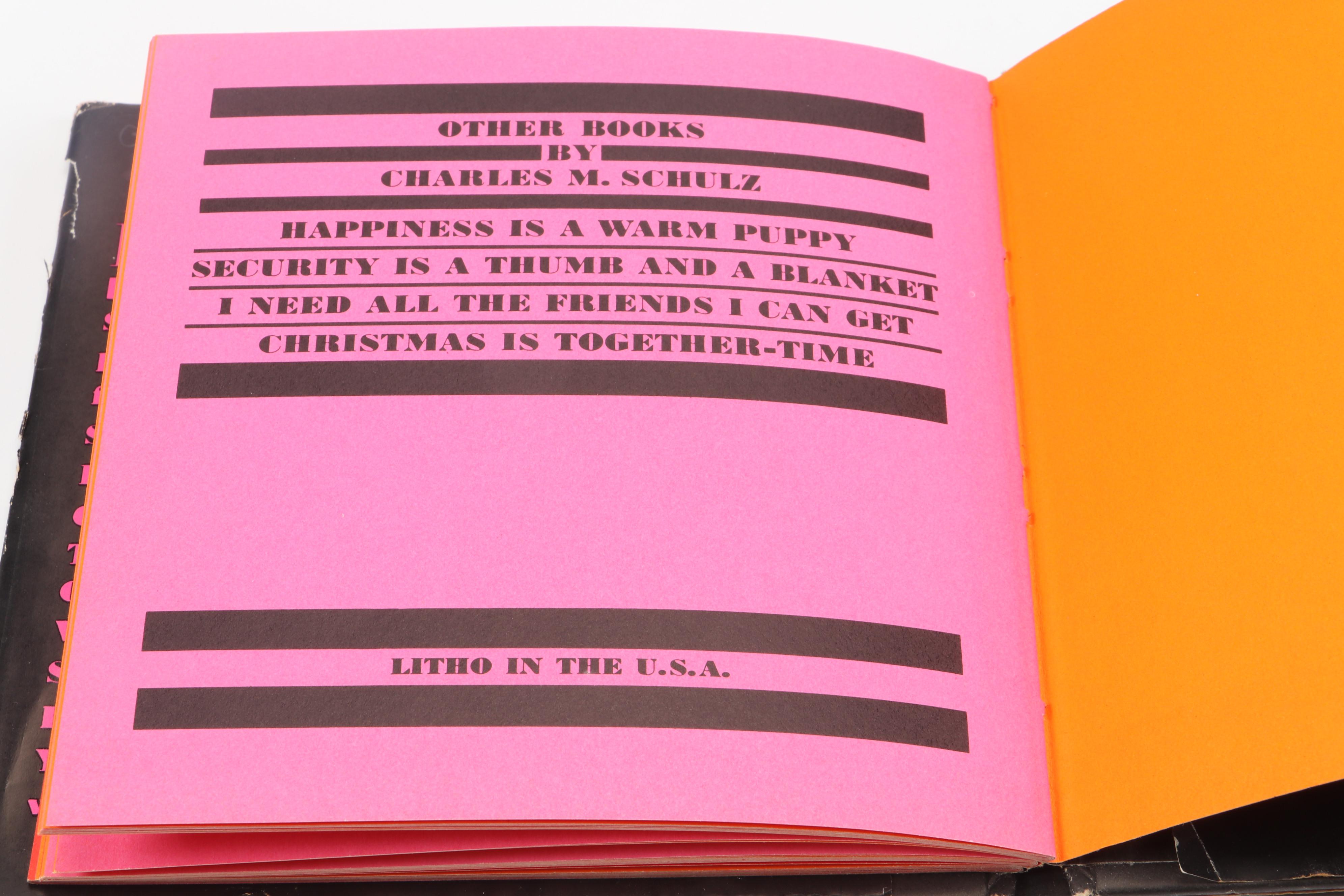 "The Complete Peanuts" and "Love is Walking Hand in Hand" by Charles M. Schulz