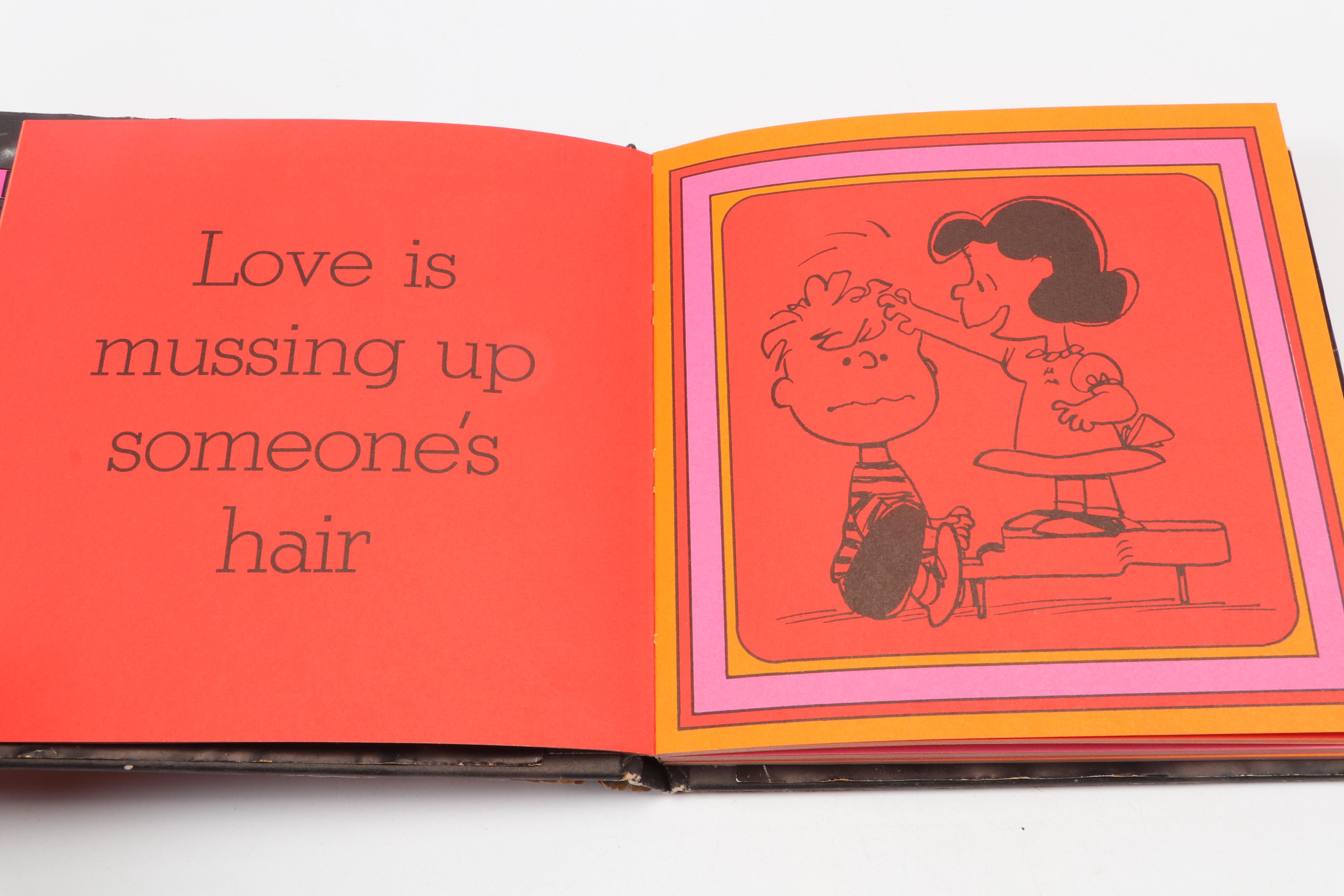 "The Complete Peanuts" and "Love is Walking Hand in Hand" by Charles M. Schulz
