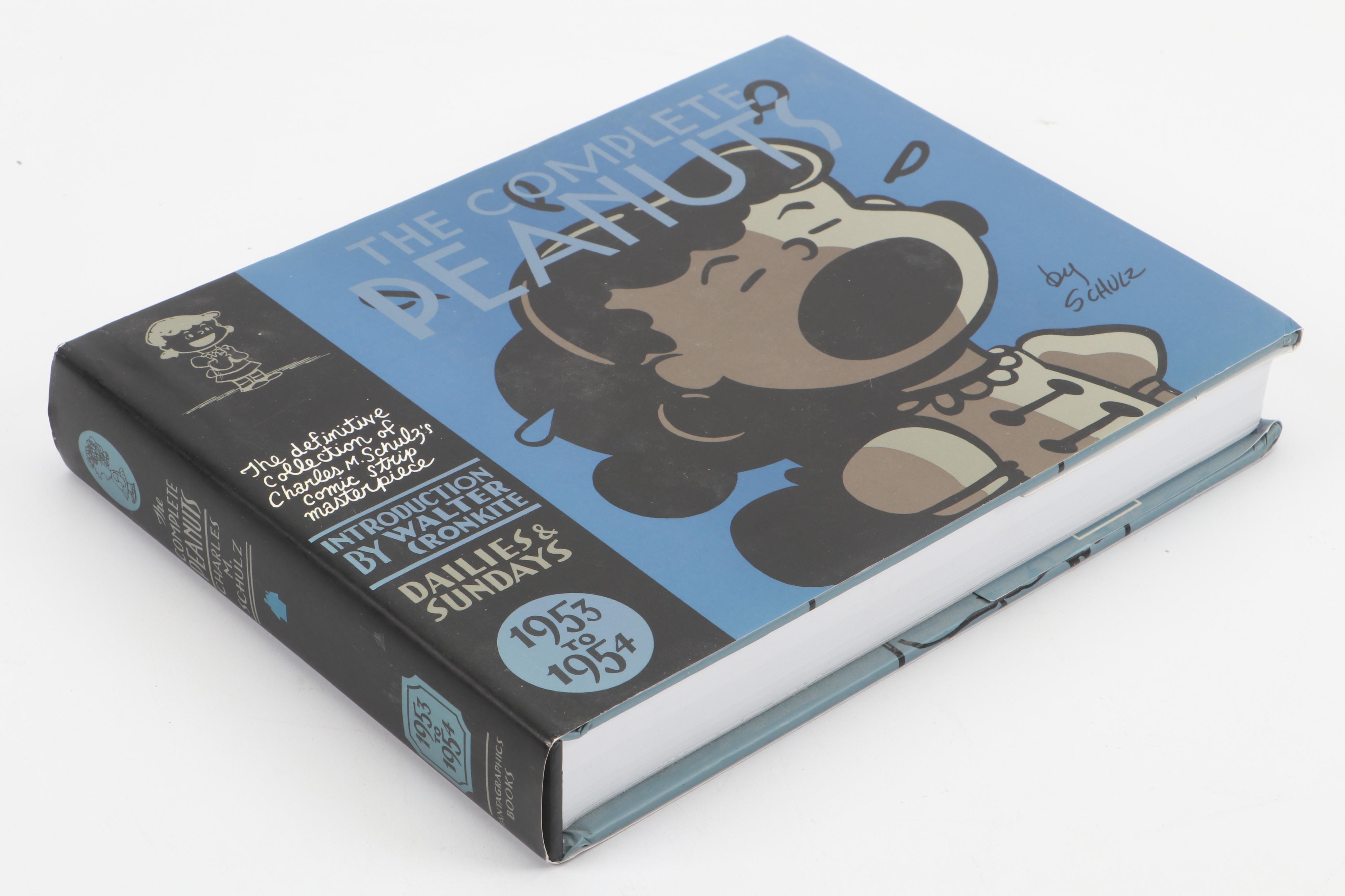 "The Complete Peanuts" and "Love is Walking Hand in Hand" by Charles M. Schulz