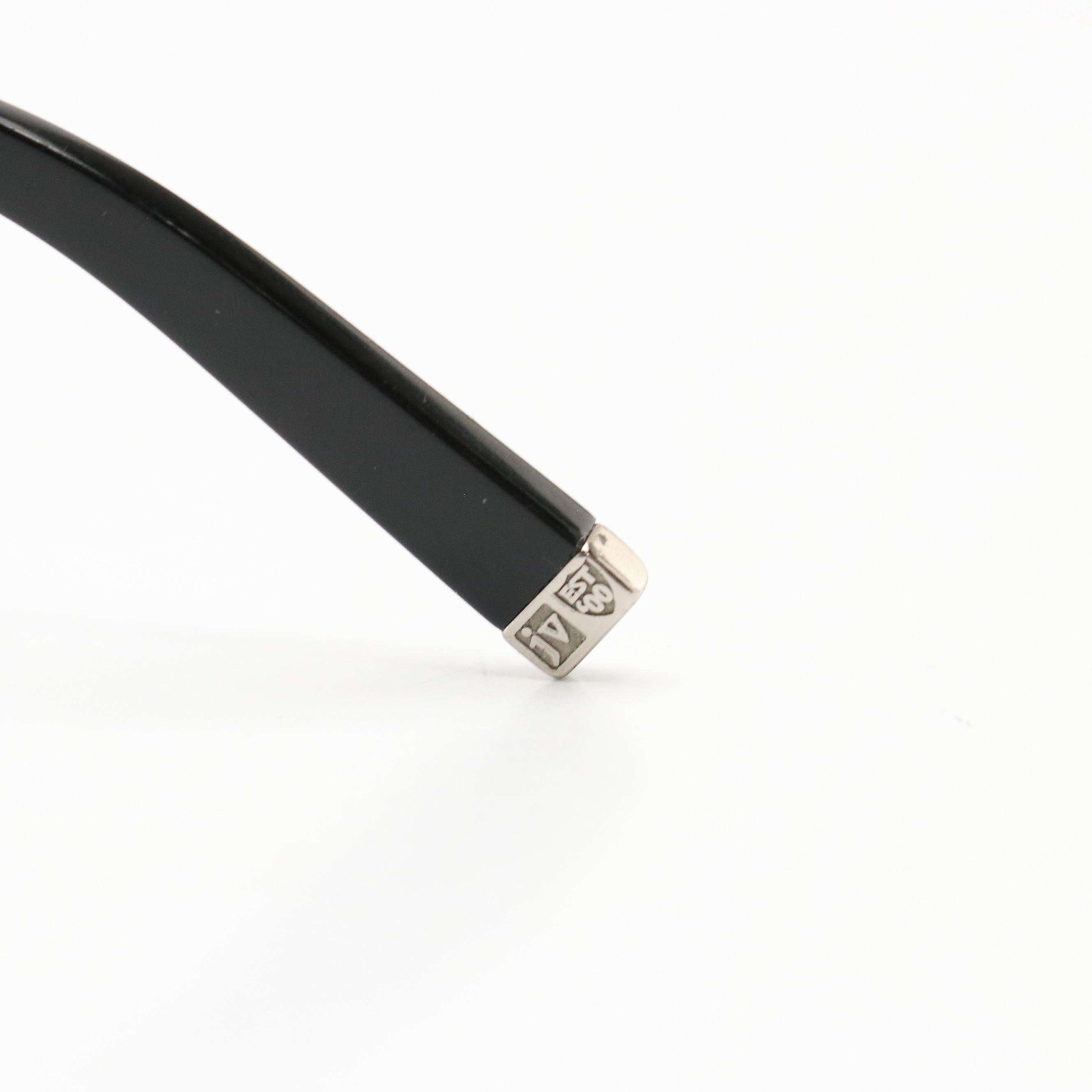 Prada SPR07G Wrap and John Varvatos V726 Oval Sunglasses