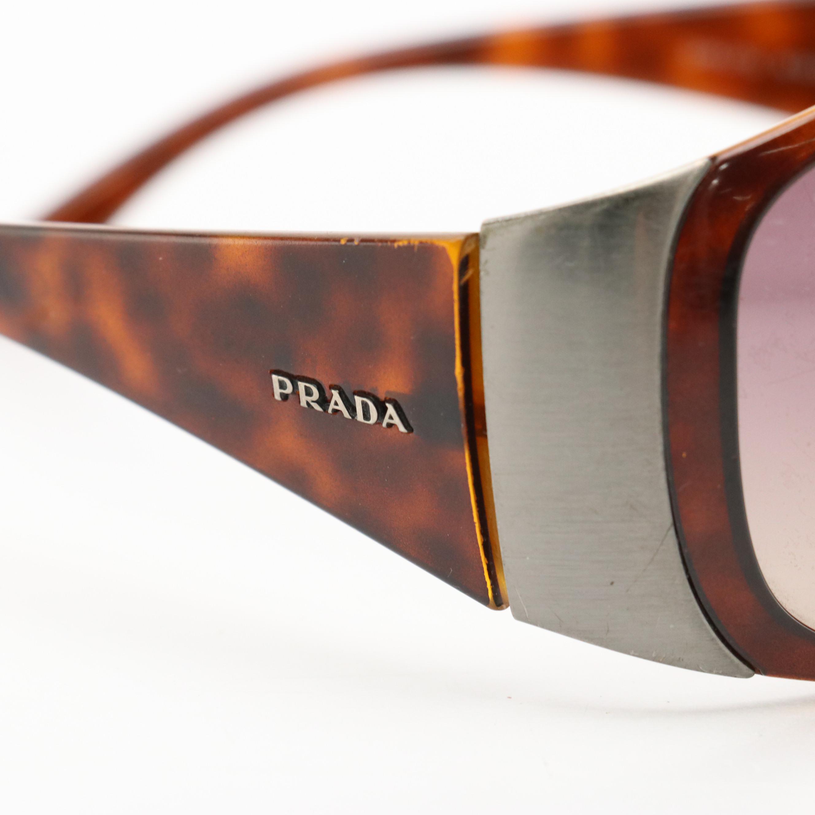Prada SPR07G Wrap and John Varvatos V726 Oval Sunglasses