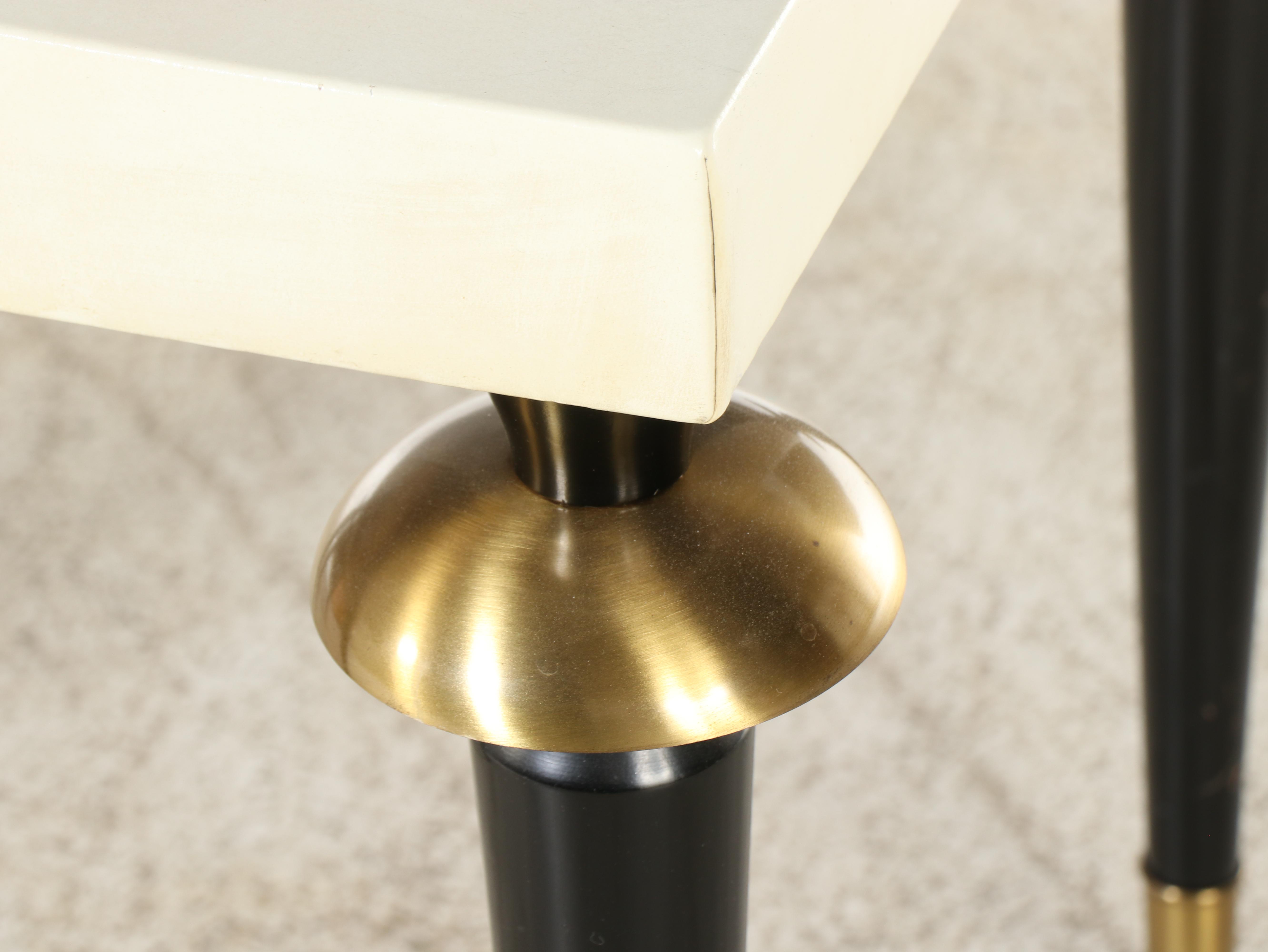 Pair of S.J. Campbell Co. Brass-Mounted, Ebonized, and Leather-Clad Side Tables