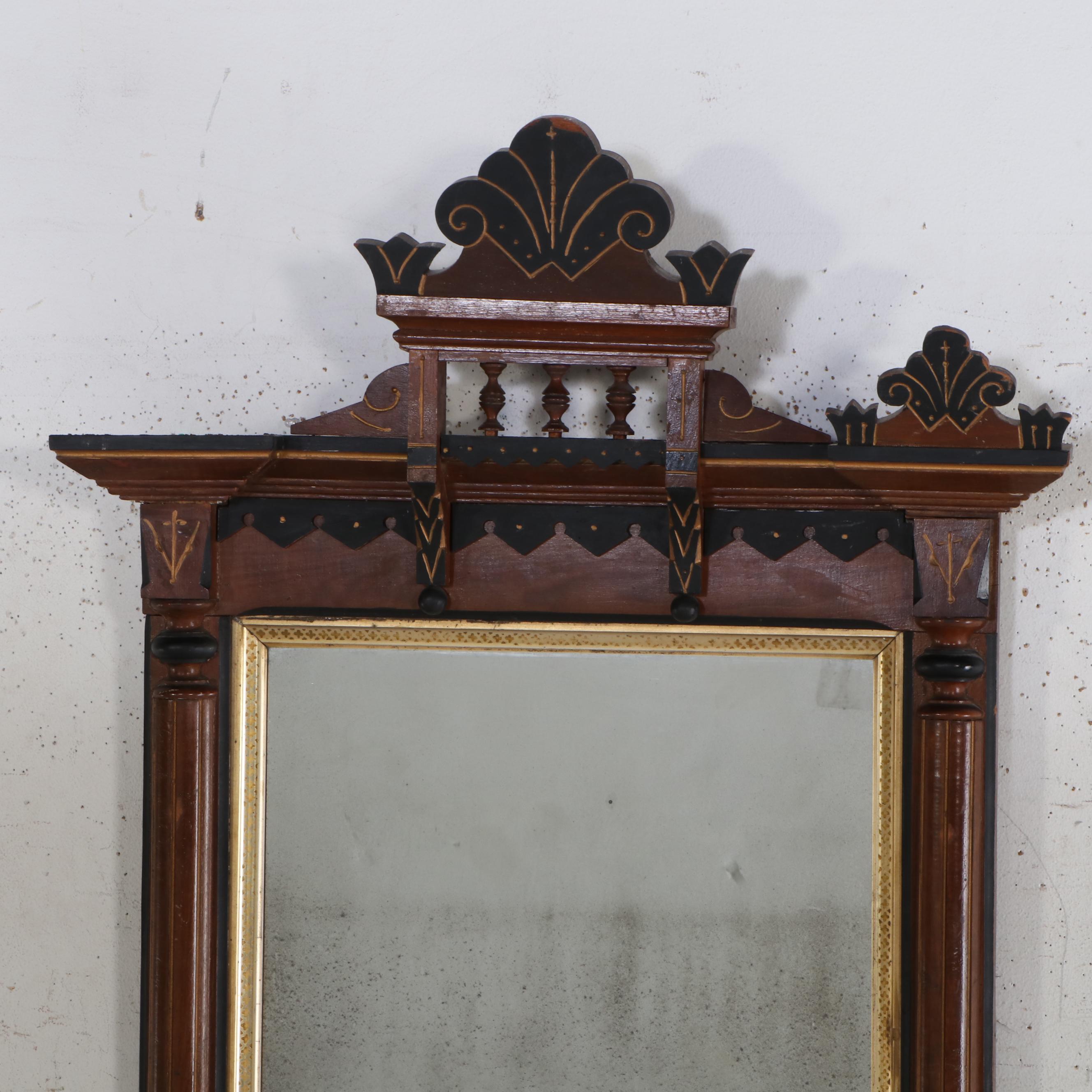Eastlake Style Parcel Gilt and Ebonized Wood Wall Mirror, Late 19th Century