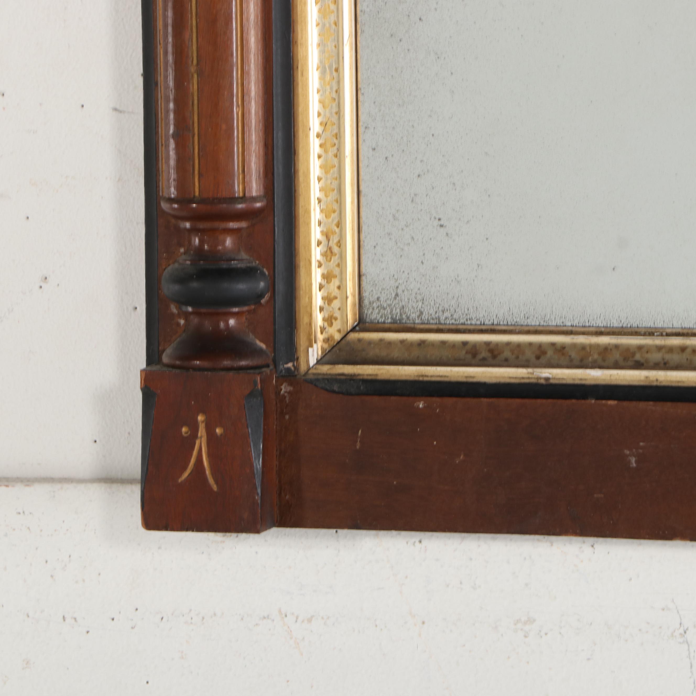 Eastlake Style Parcel Gilt and Ebonized Wood Wall Mirror, Late 19th Century