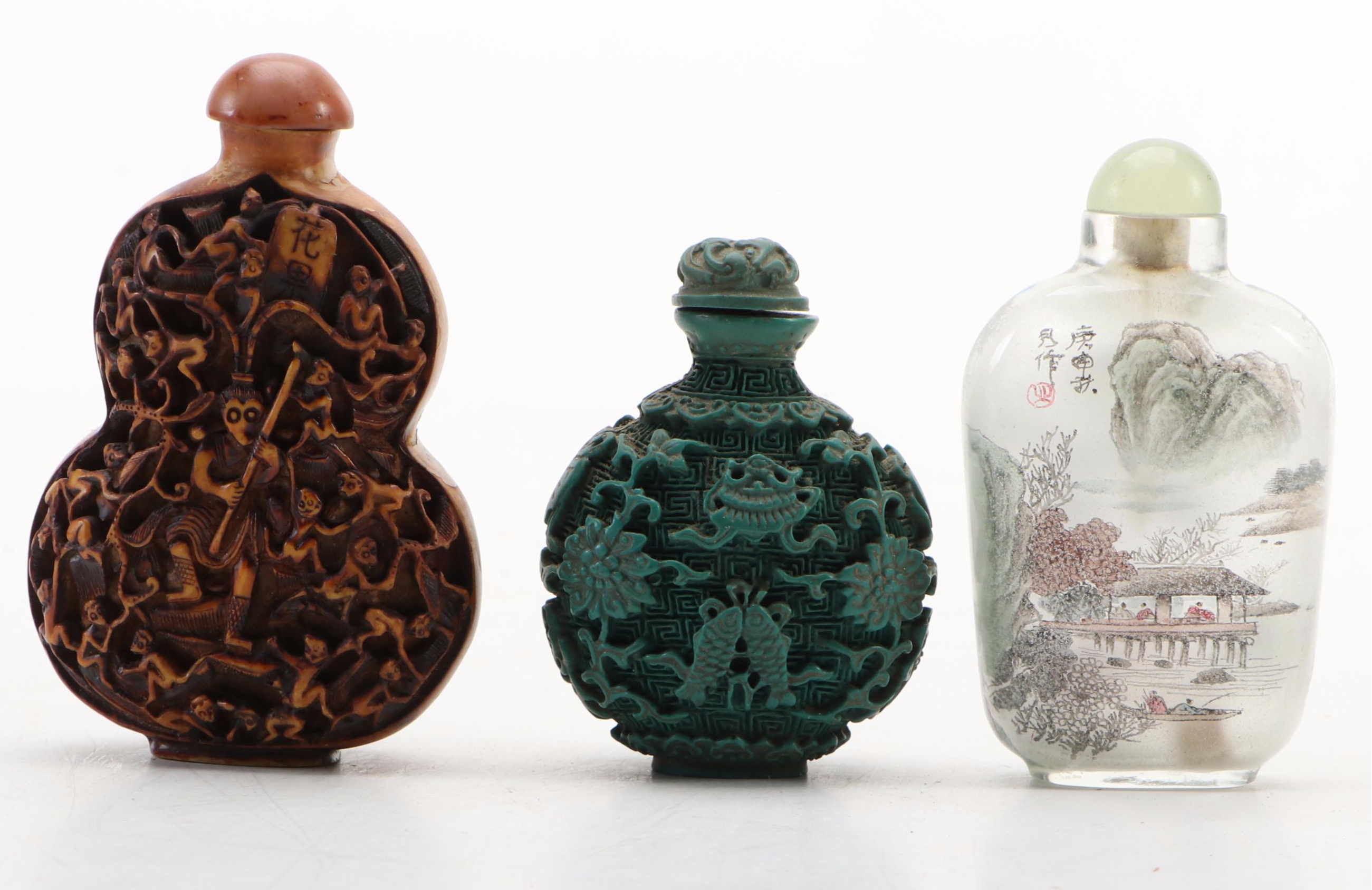 Chinese Reverse Painted Glass and Faux Cinnabar Style Carved Resin Snuff Bottles