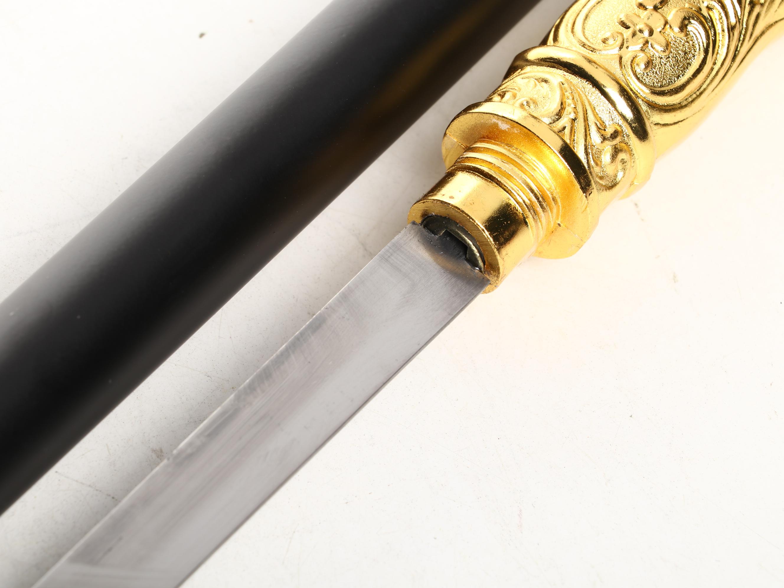 Embossed Acanthus Leaf Gold Tone Handle Sword Cane