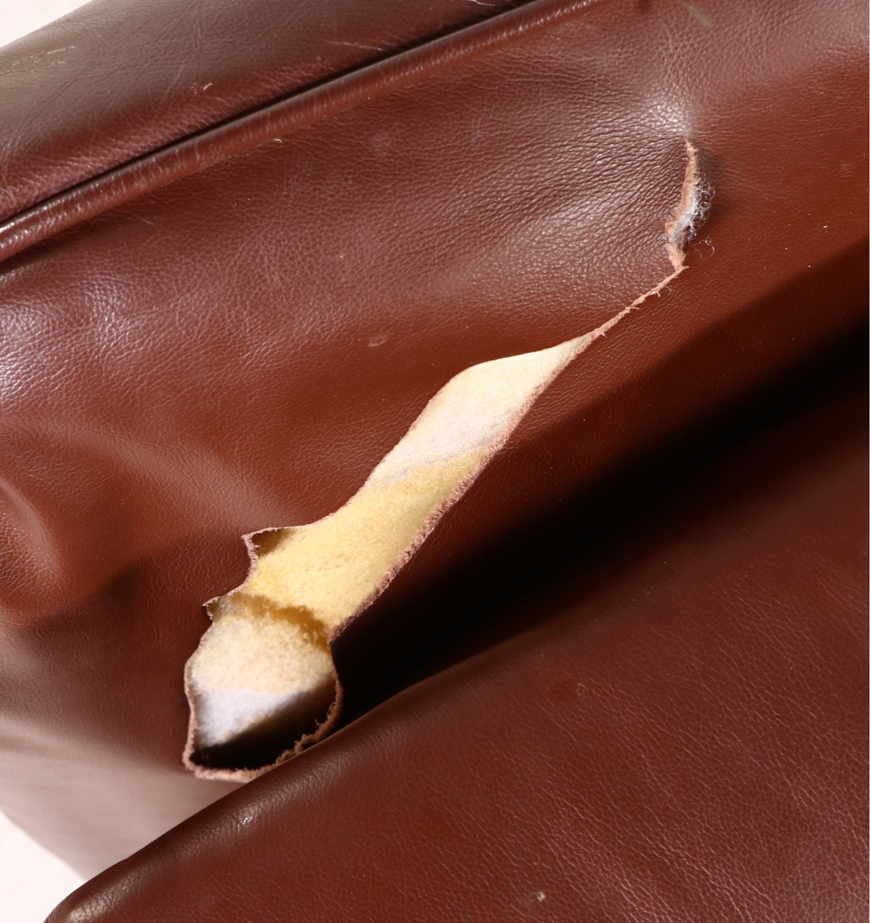 Hancock & Moore Brown Leather Armchair and Ottoman, Late 20th Century