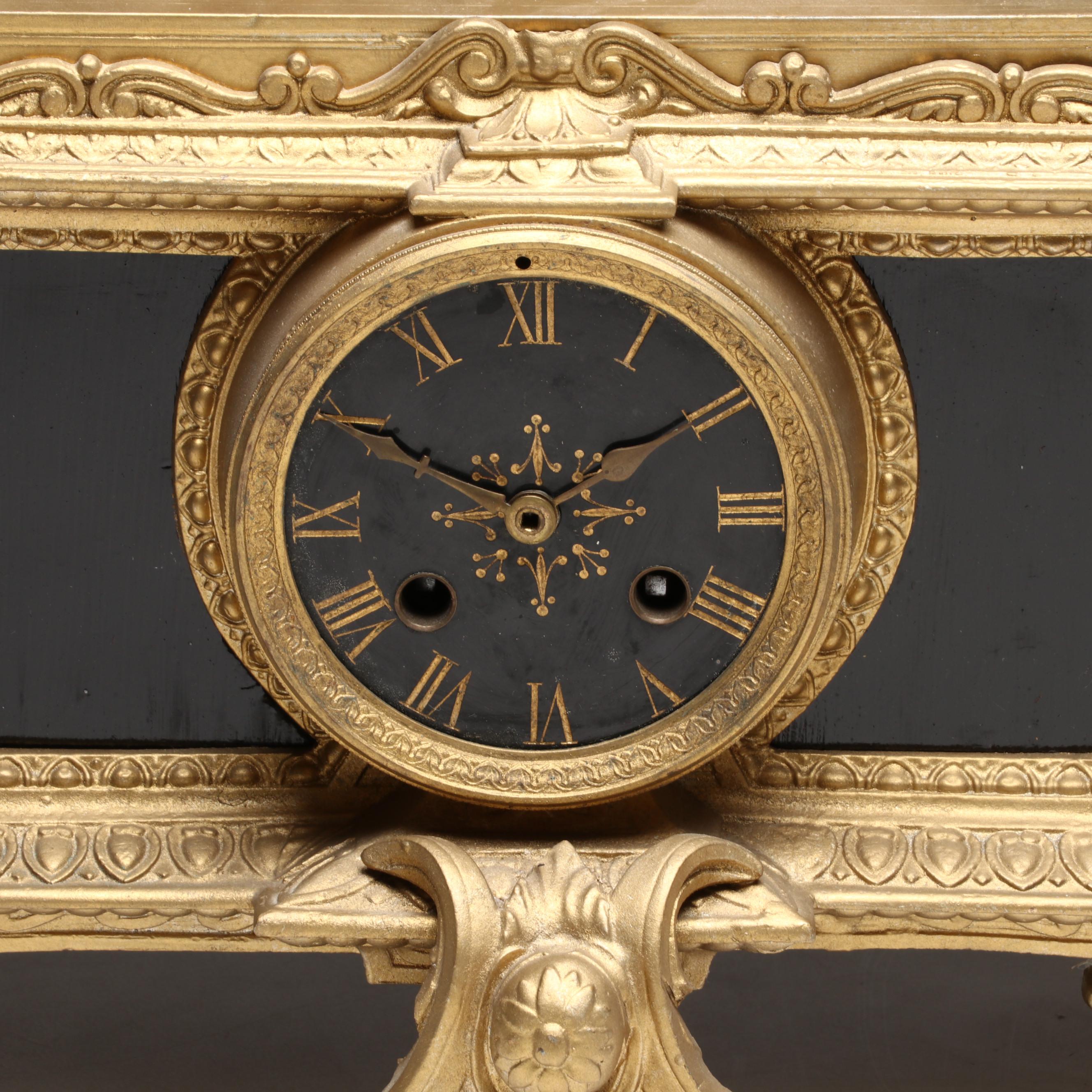 Brunfaut French Empire Style Gilt and Ebonized Metal Figural Mantel Clock