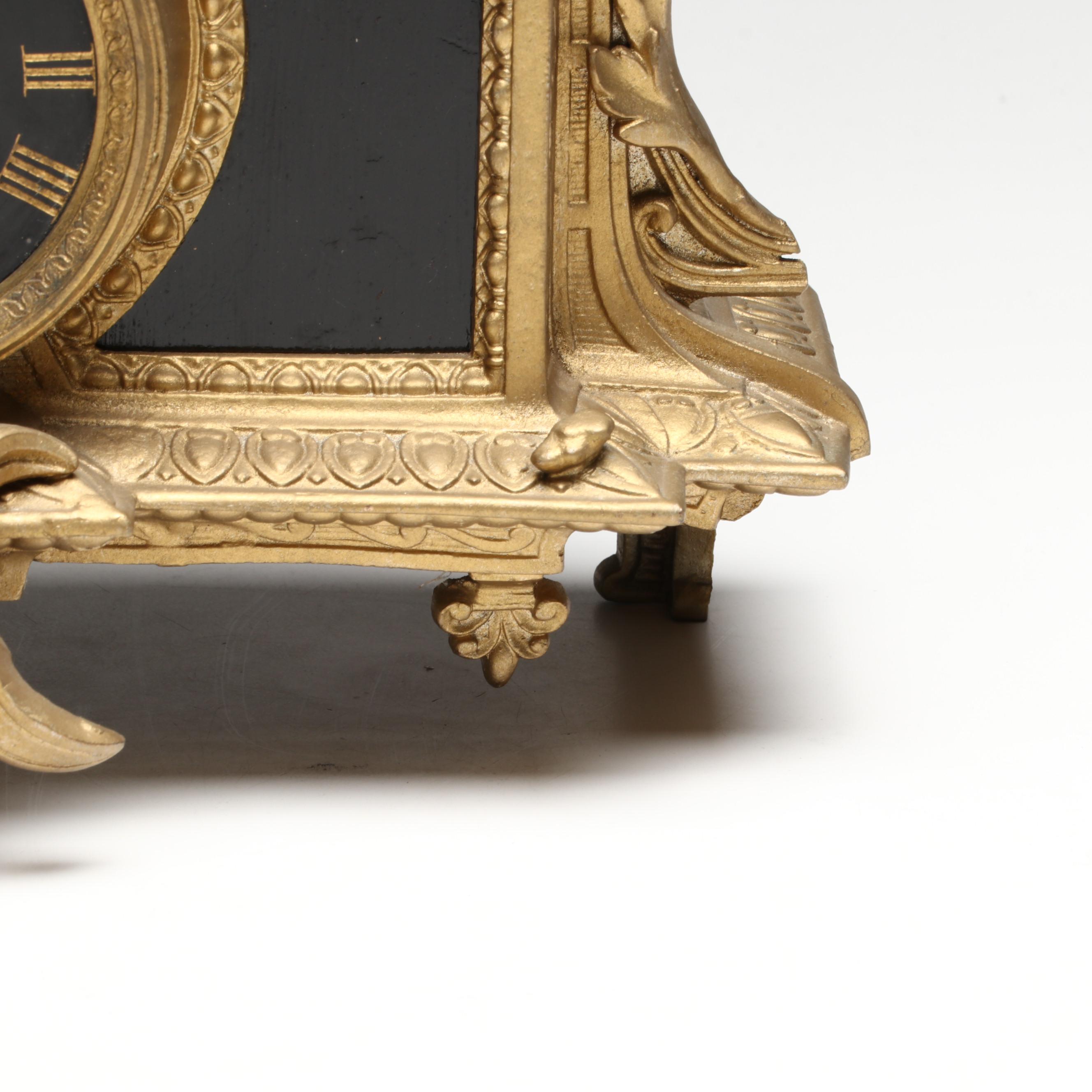 Brunfaut French Empire Style Gilt and Ebonized Metal Figural Mantel Clock