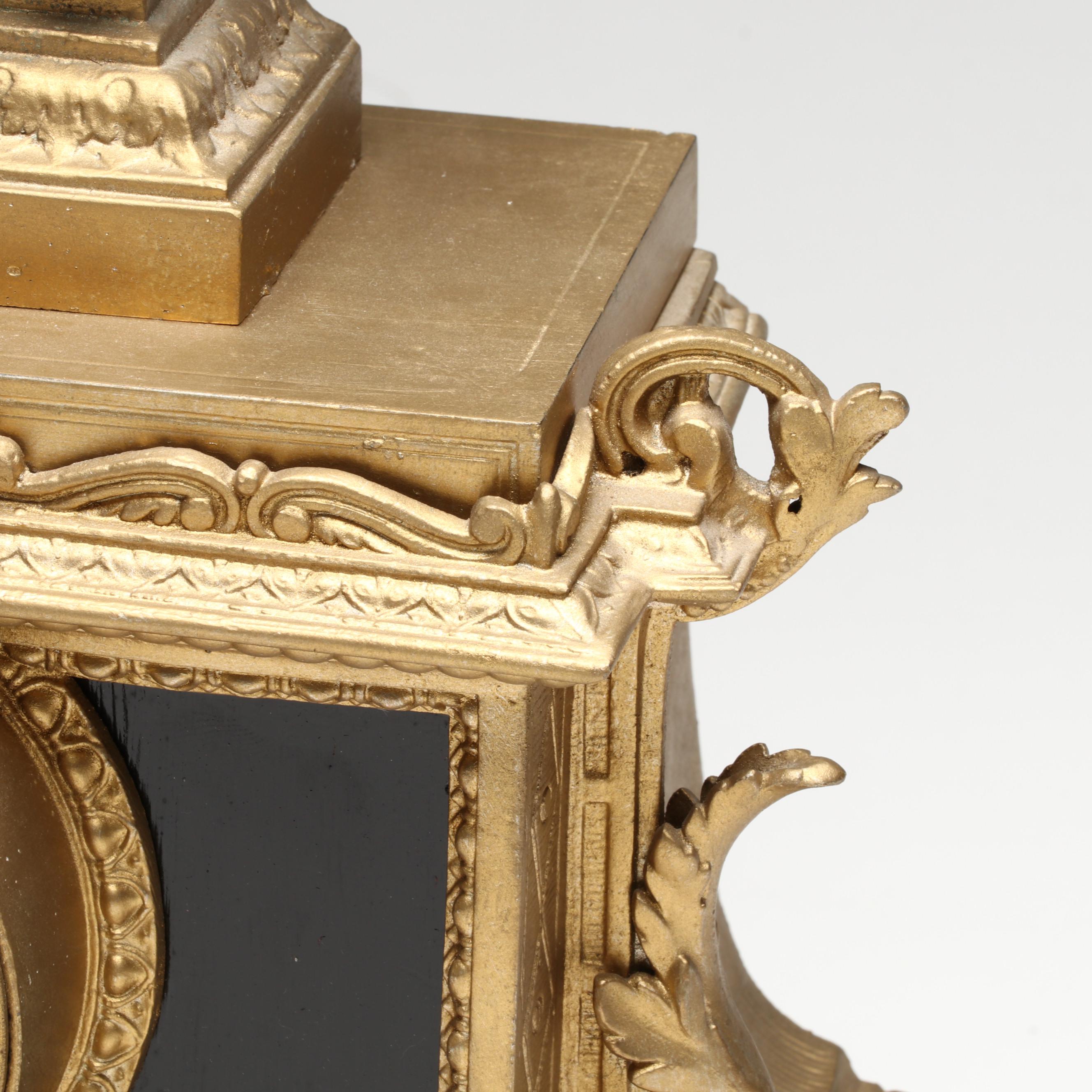 Brunfaut French Empire Style Gilt and Ebonized Metal Figural Mantel Clock