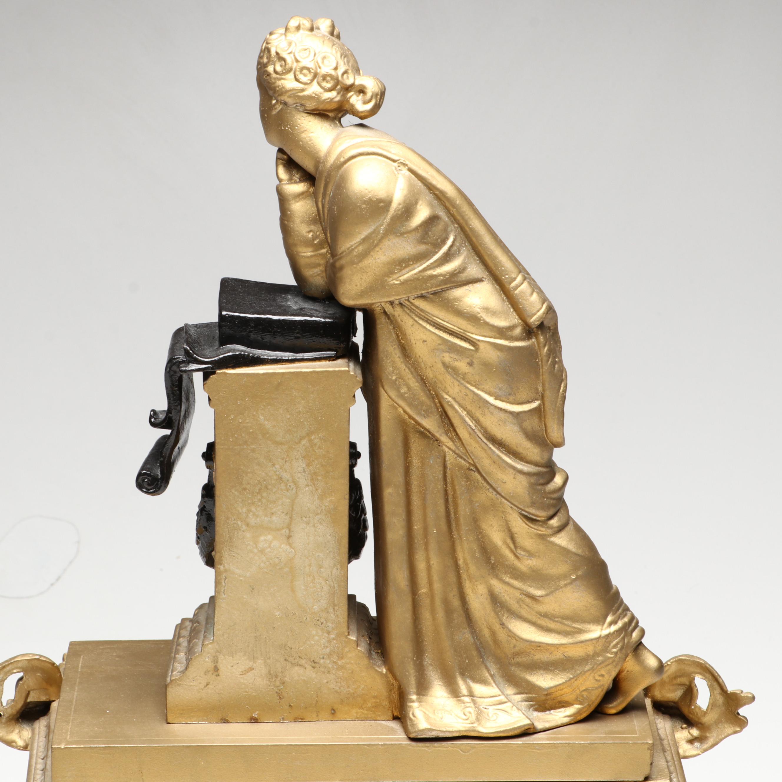 Brunfaut French Empire Style Gilt and Ebonized Metal Figural Mantel Clock