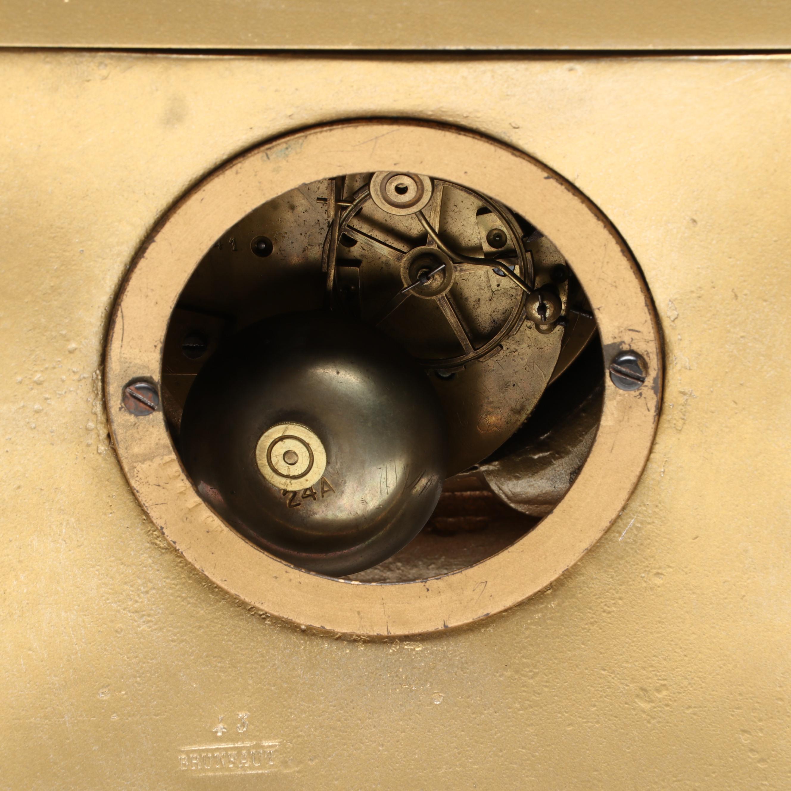 Brunfaut French Empire Style Gilt and Ebonized Metal Figural Mantel Clock