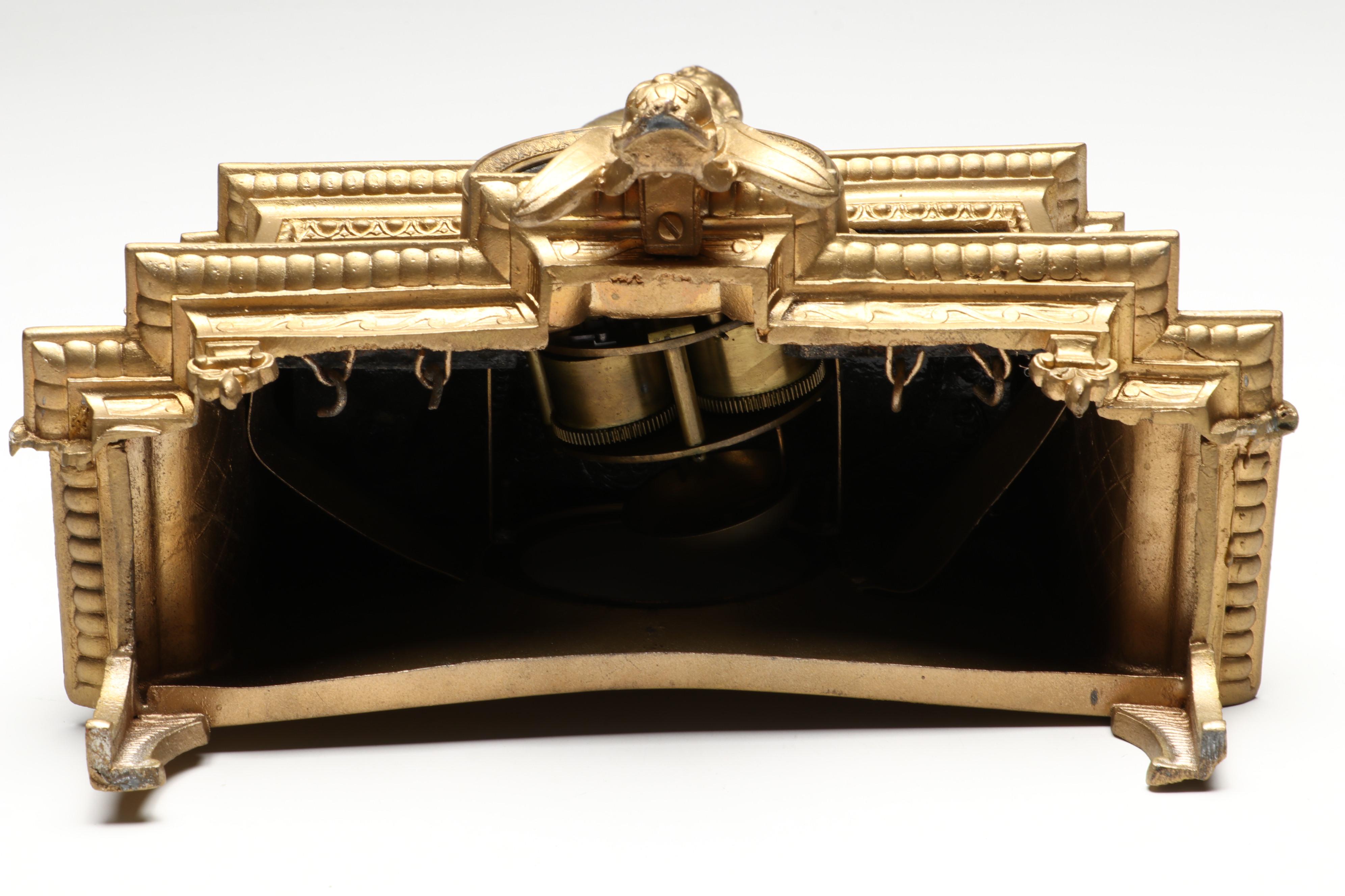 Brunfaut French Empire Style Gilt and Ebonized Metal Figural Mantel Clock