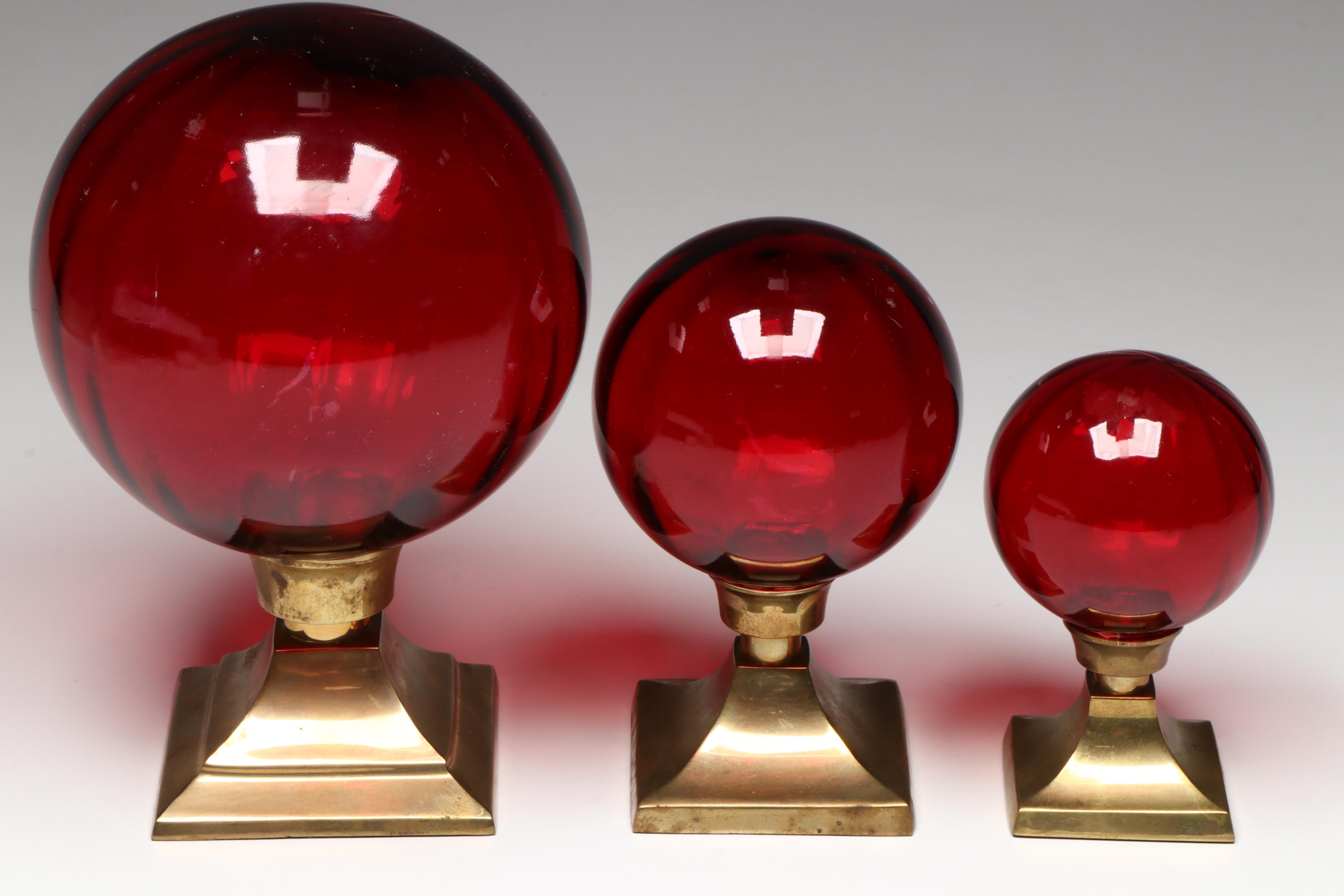 Two's Company Optic Red Glass Orbs on Brass Mounts