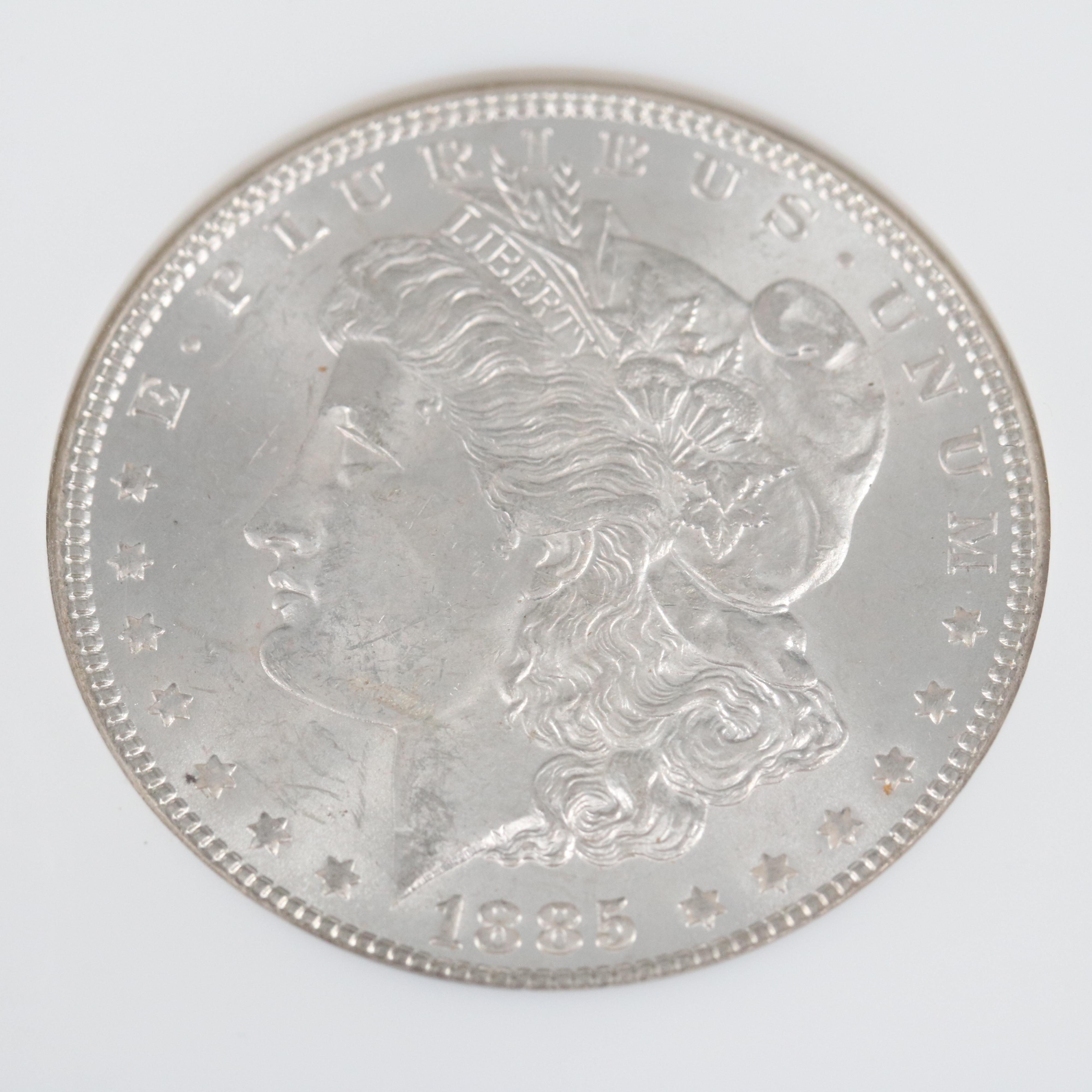 Two NGC Graded MS63 Morgan Silver Dollars, 1885 and 1885-O