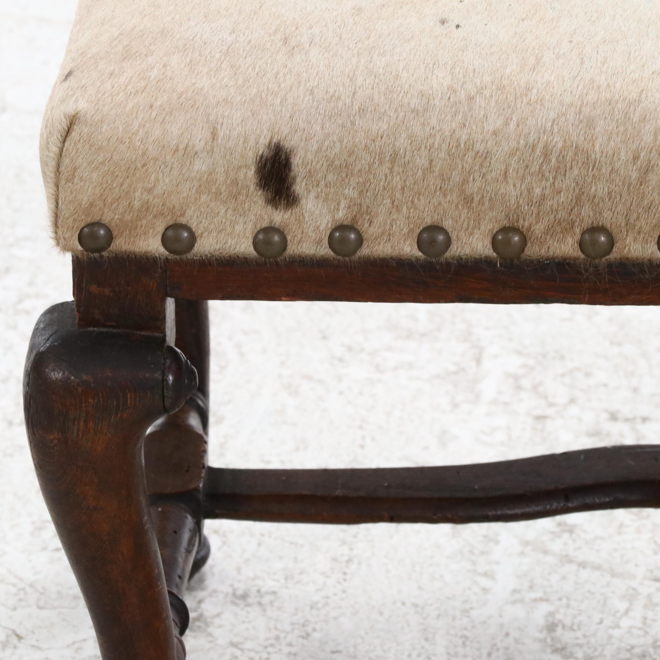 Pair of Cowhide Upholstered Carved Wood Footstools