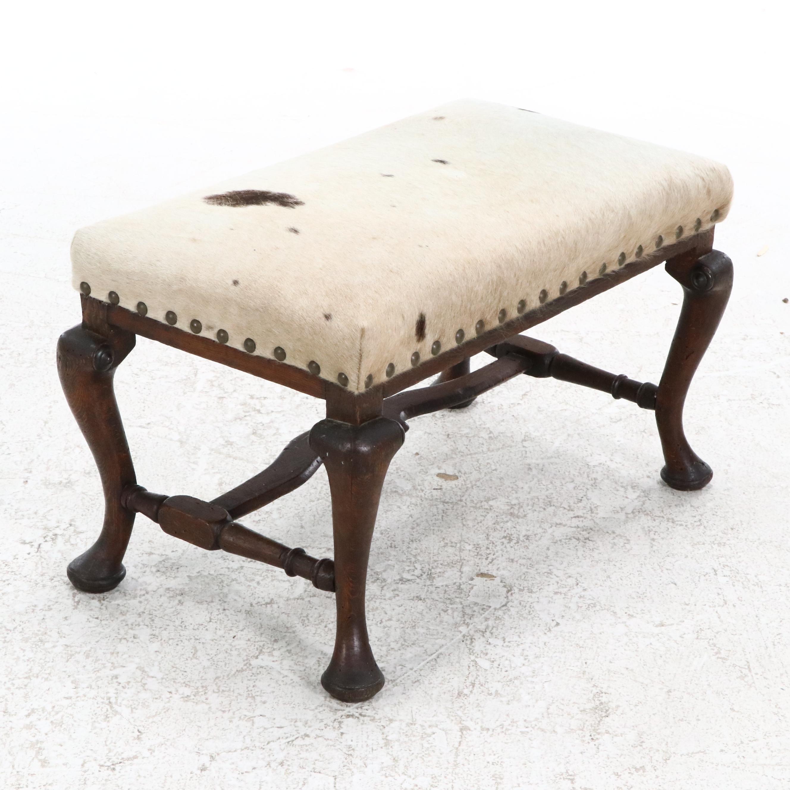 Pair of Cowhide Upholstered Carved Wood Footstools