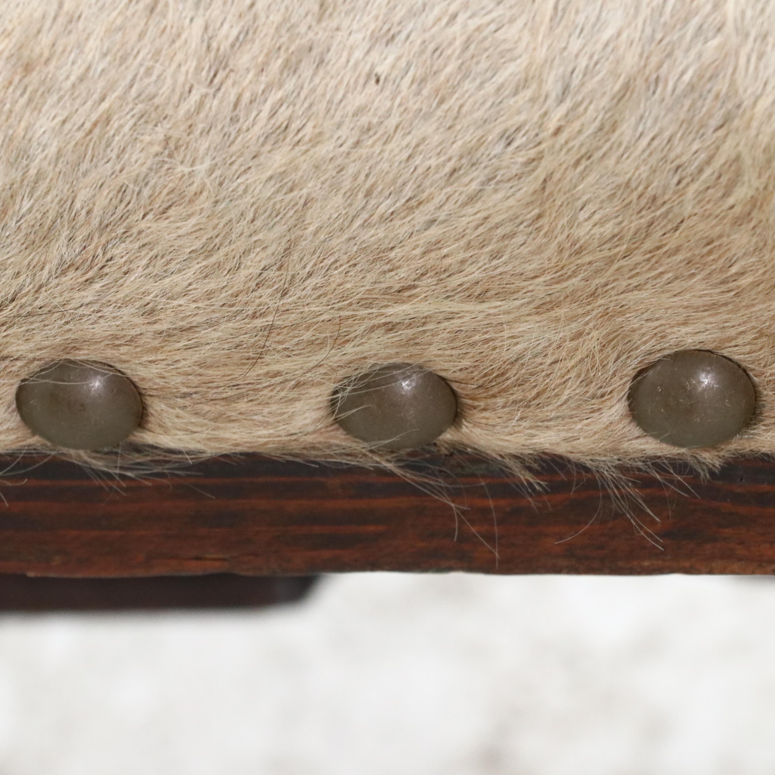 Pair of Cowhide Upholstered Carved Wood Footstools