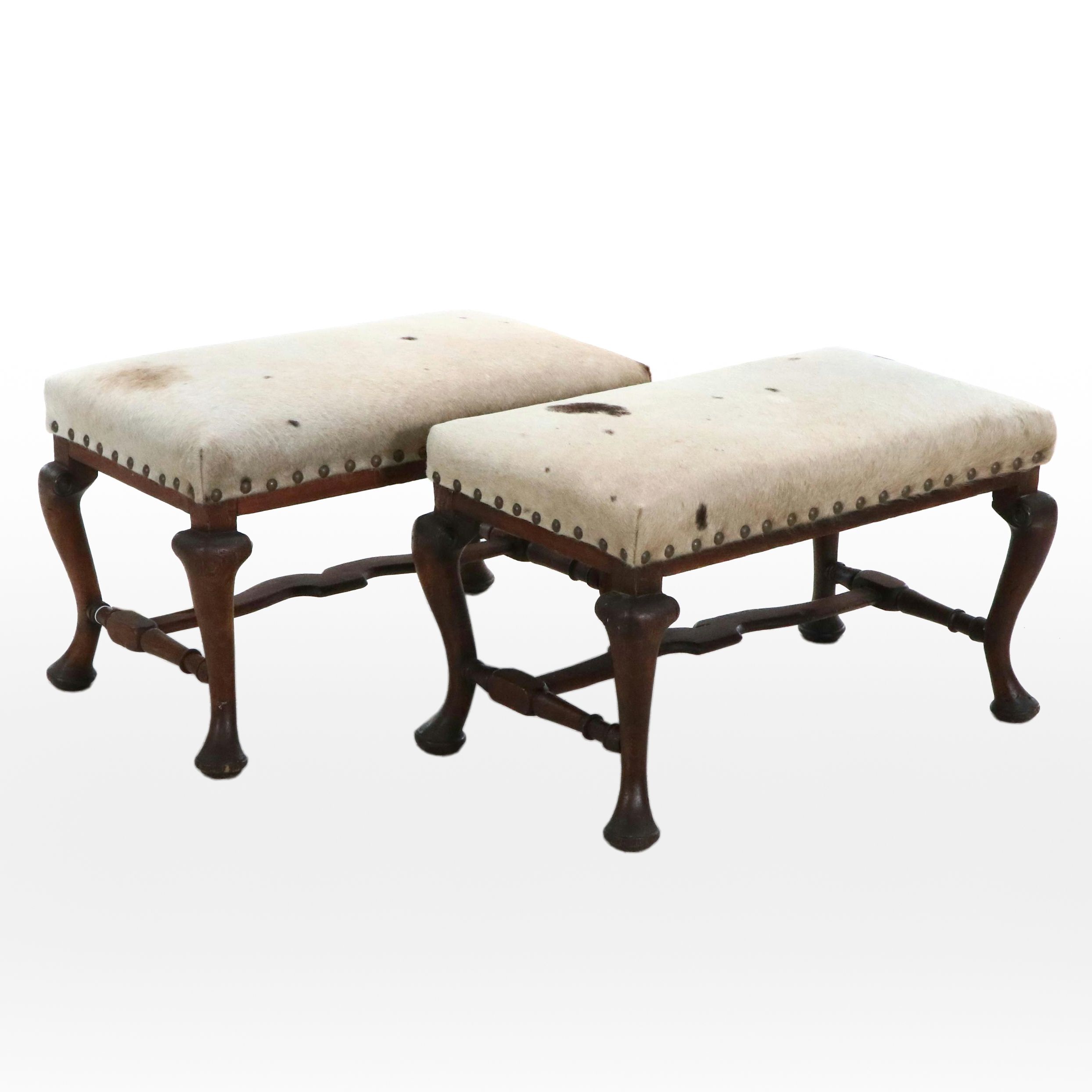 Pair of Cowhide Upholstered Carved Wood Footstools