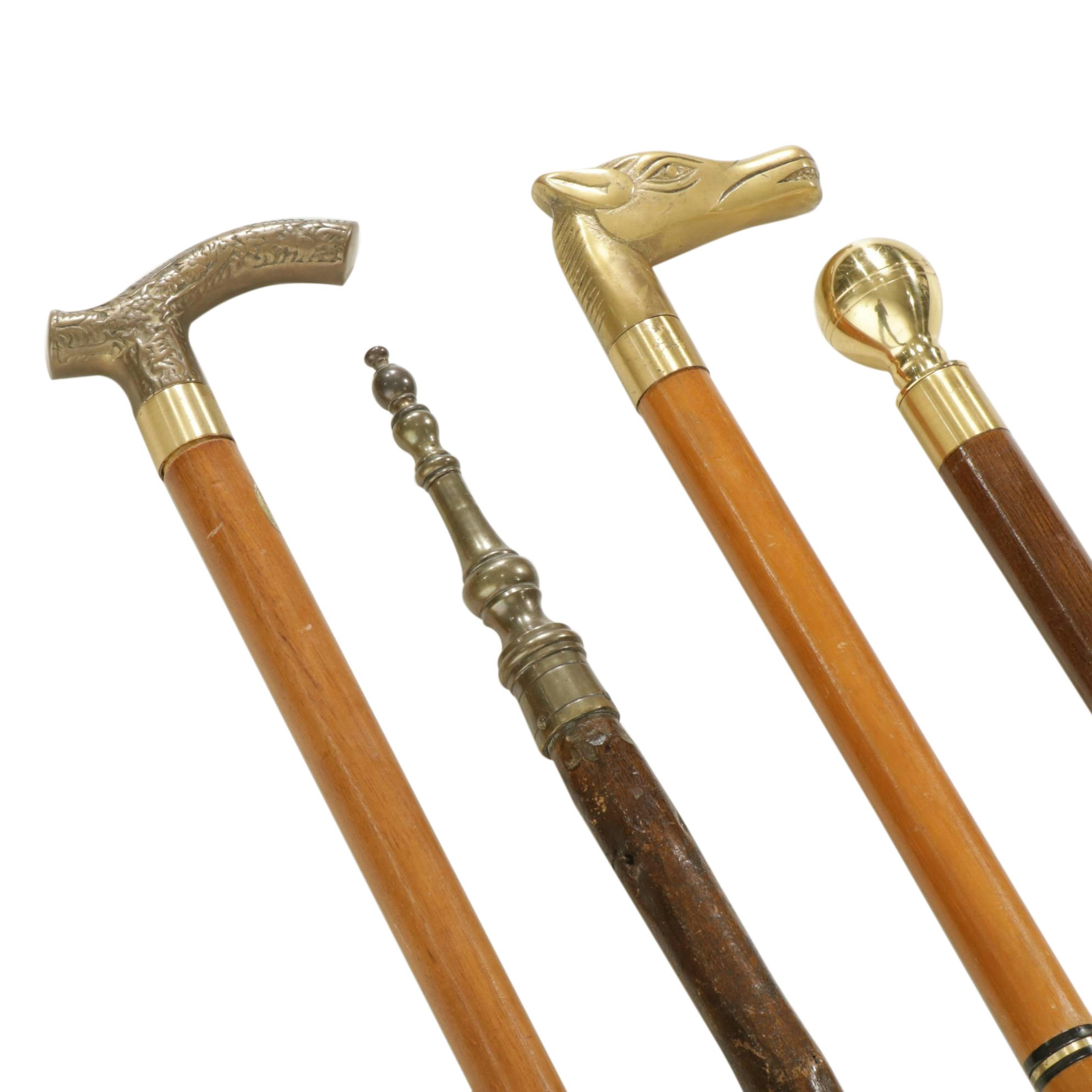 Hidden Compass and Dagger Featured in Cane Quartet of Wood & Brass