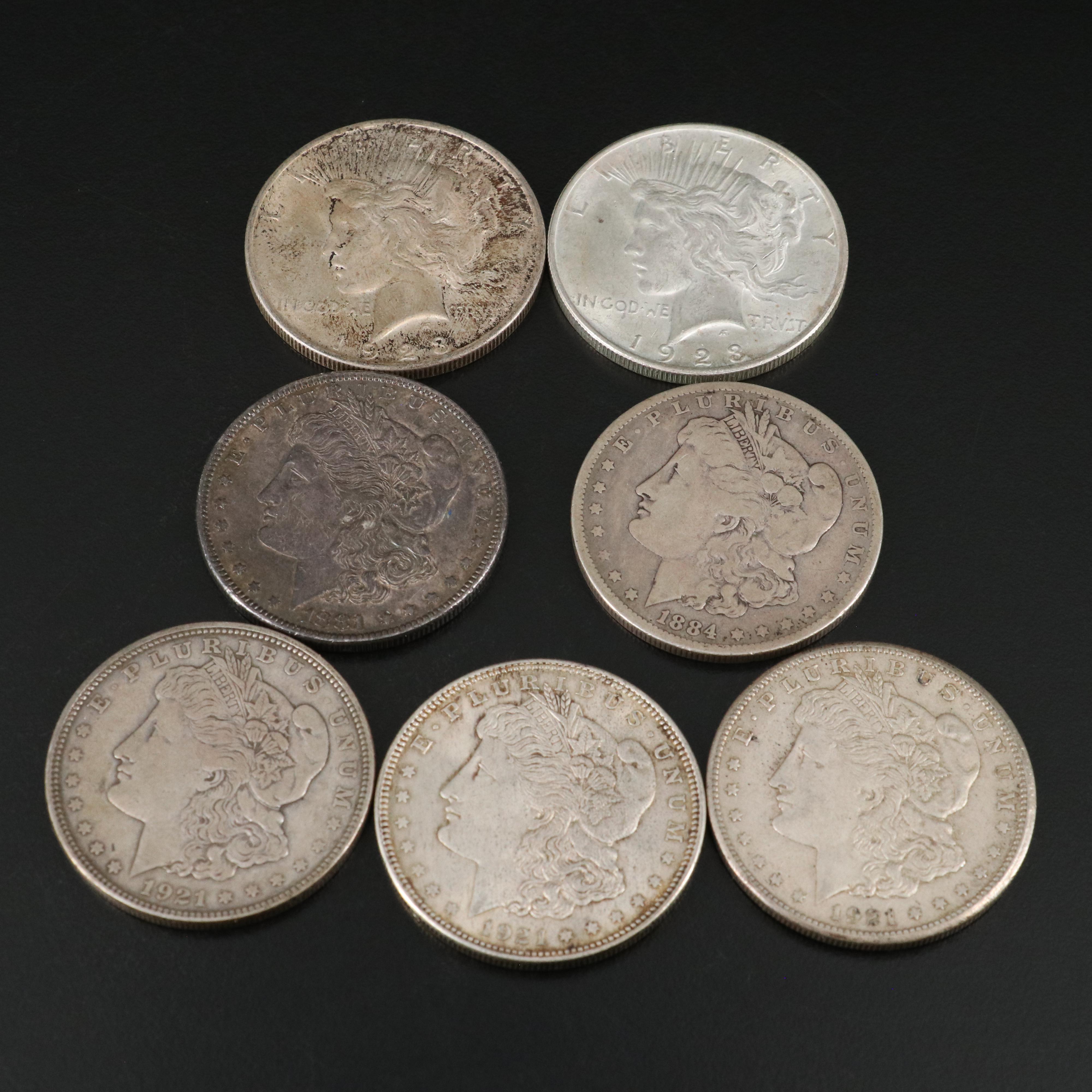 Seven U.S. Morgan and Peace Dollars