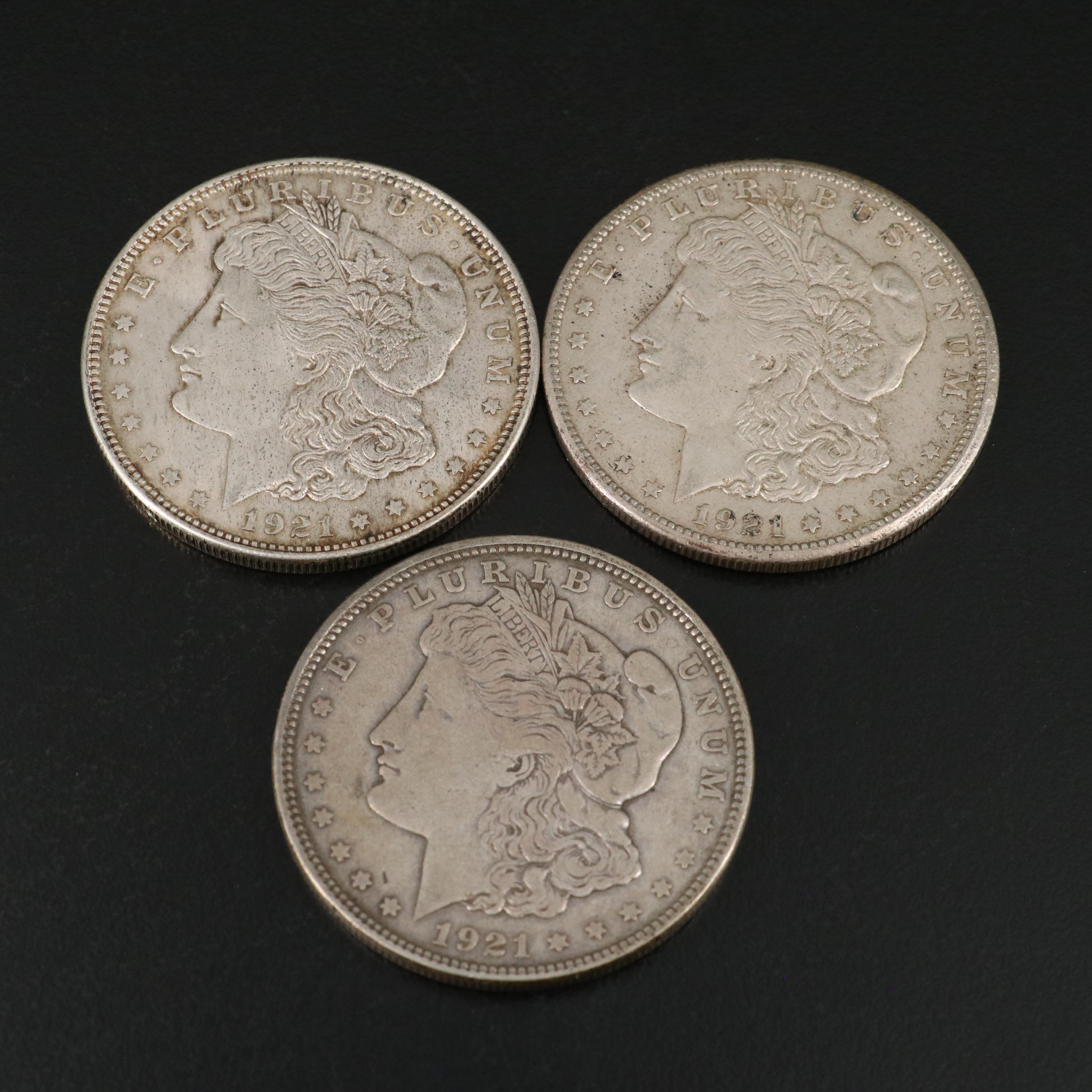 Seven U.S. Morgan and Peace Dollars