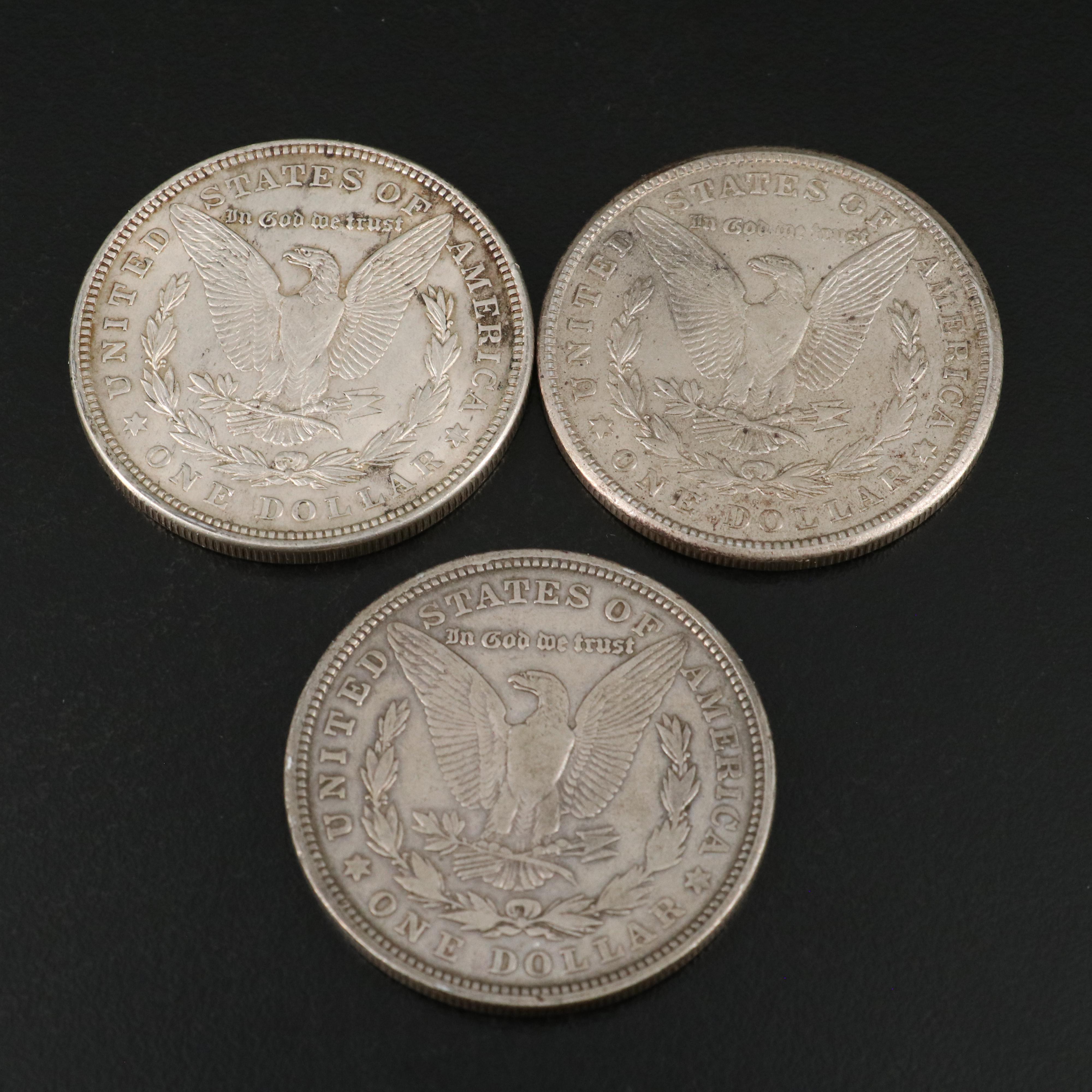 Seven U.S. Morgan and Peace Dollars