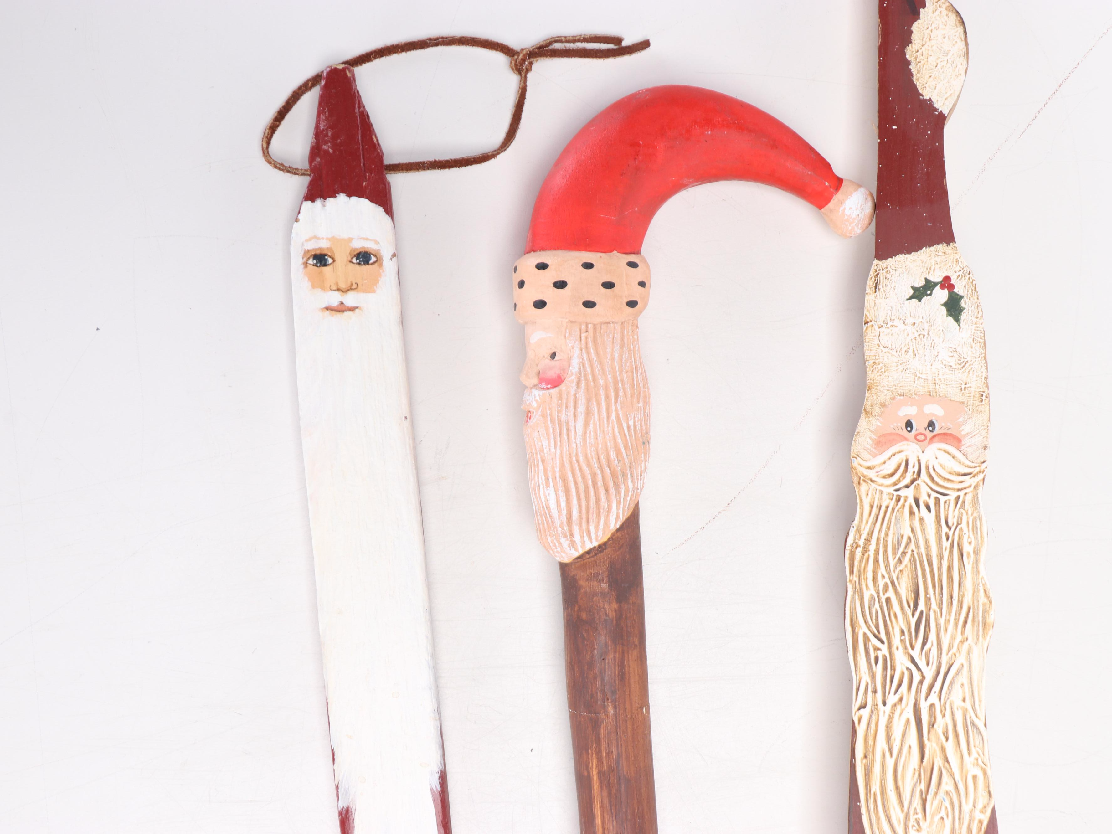 Folk Art Style Paint-Decorated Wooden Santa Claus Figure and Walking Sticks