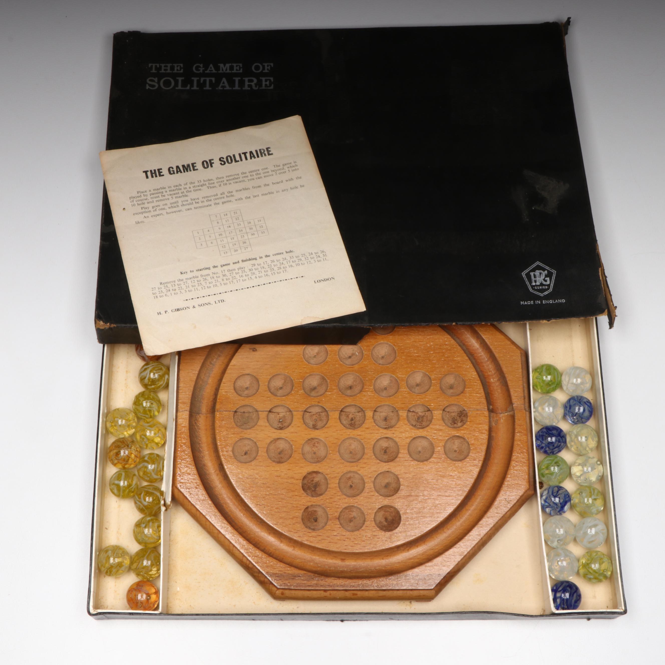 H. P. Gibson & Sons Solitaire Game in Box and Veiligglas Wire Pull Glass Marbles