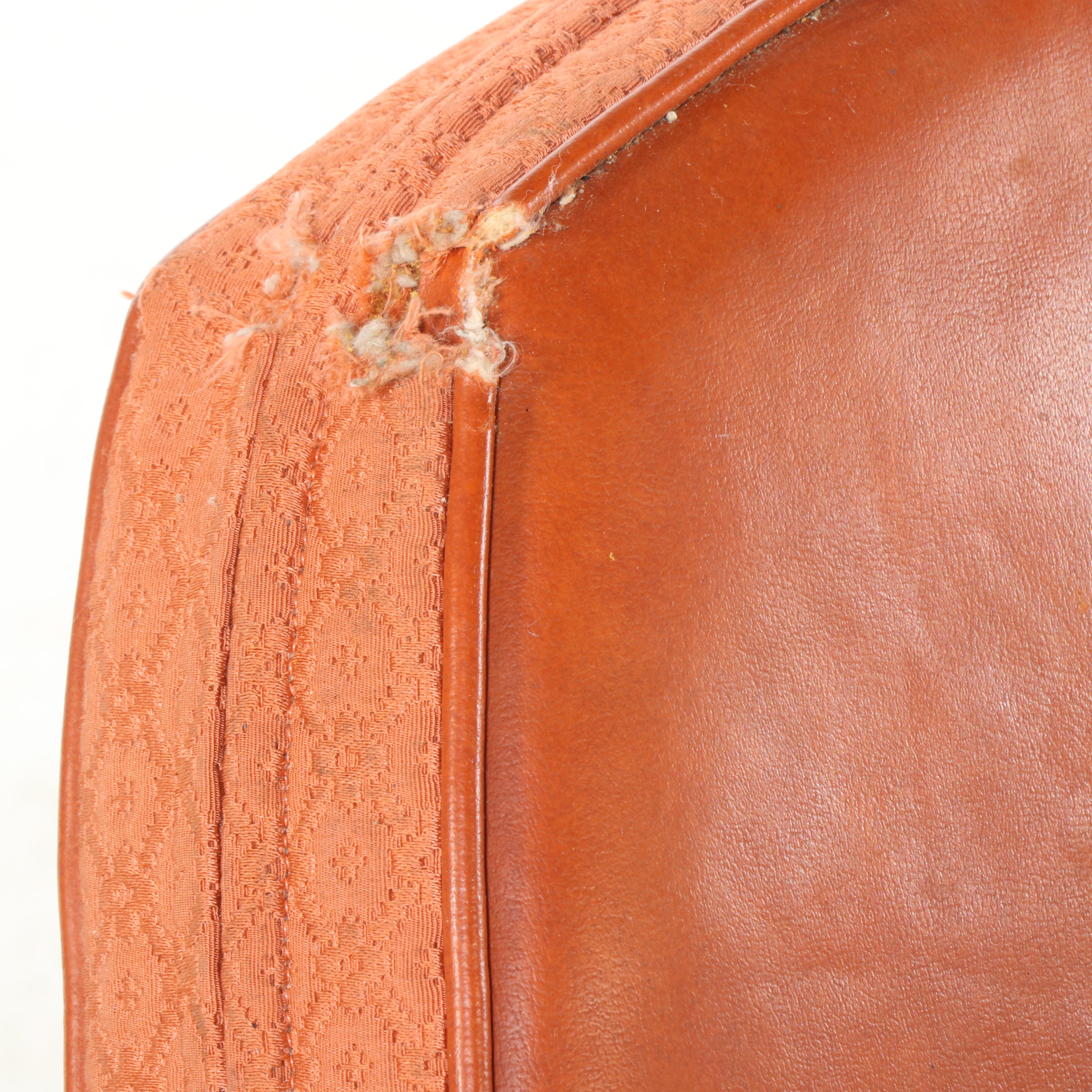 Pair of Modernist Buttoned-Down Orange Vinyl Club Chairs