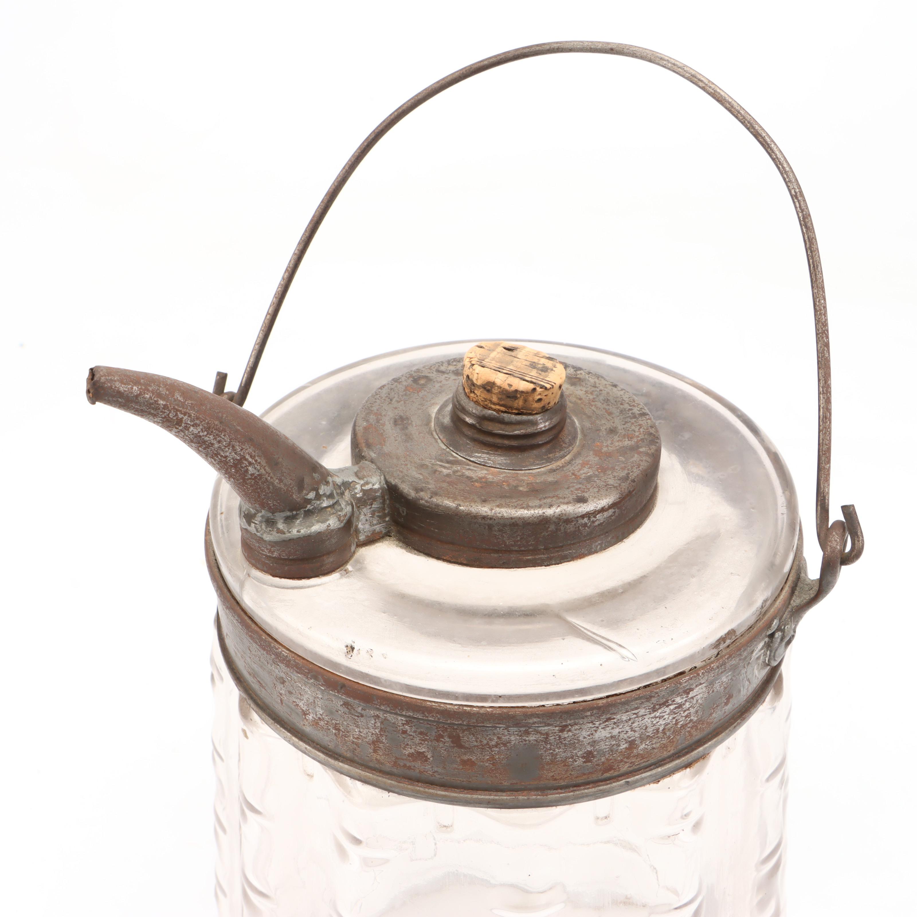 Newport Dairy Stoneware Crock, Glass Oil Can, and Wooden Spool